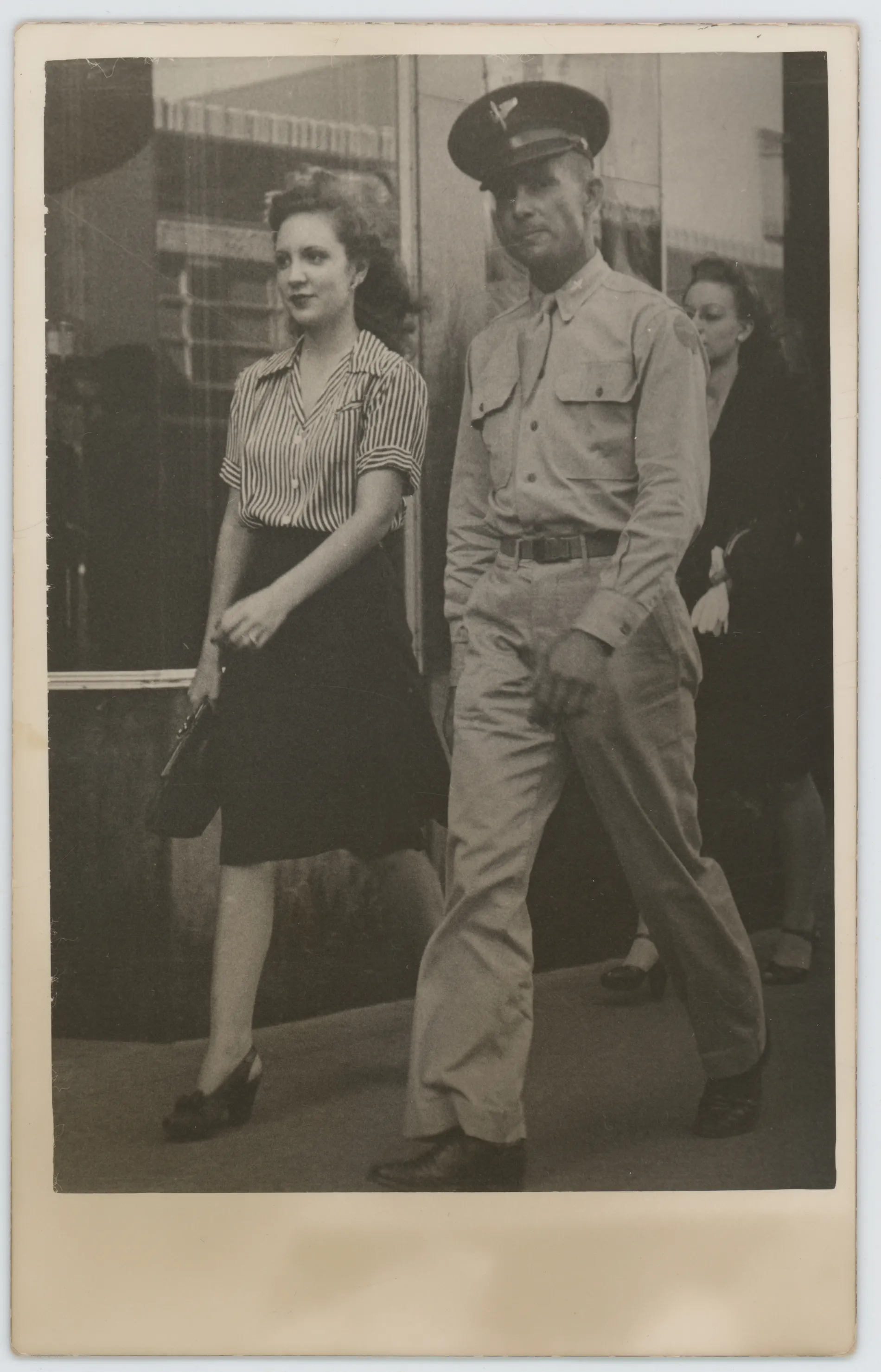 This photograph depicts Harold Allison walking along a street.