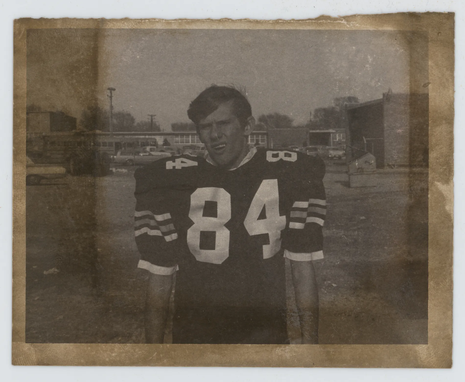 This photograph depicts Jack Allison in his football uniform from the 1968 Muleshoe Mules season. He is wearing the number 84 here.
