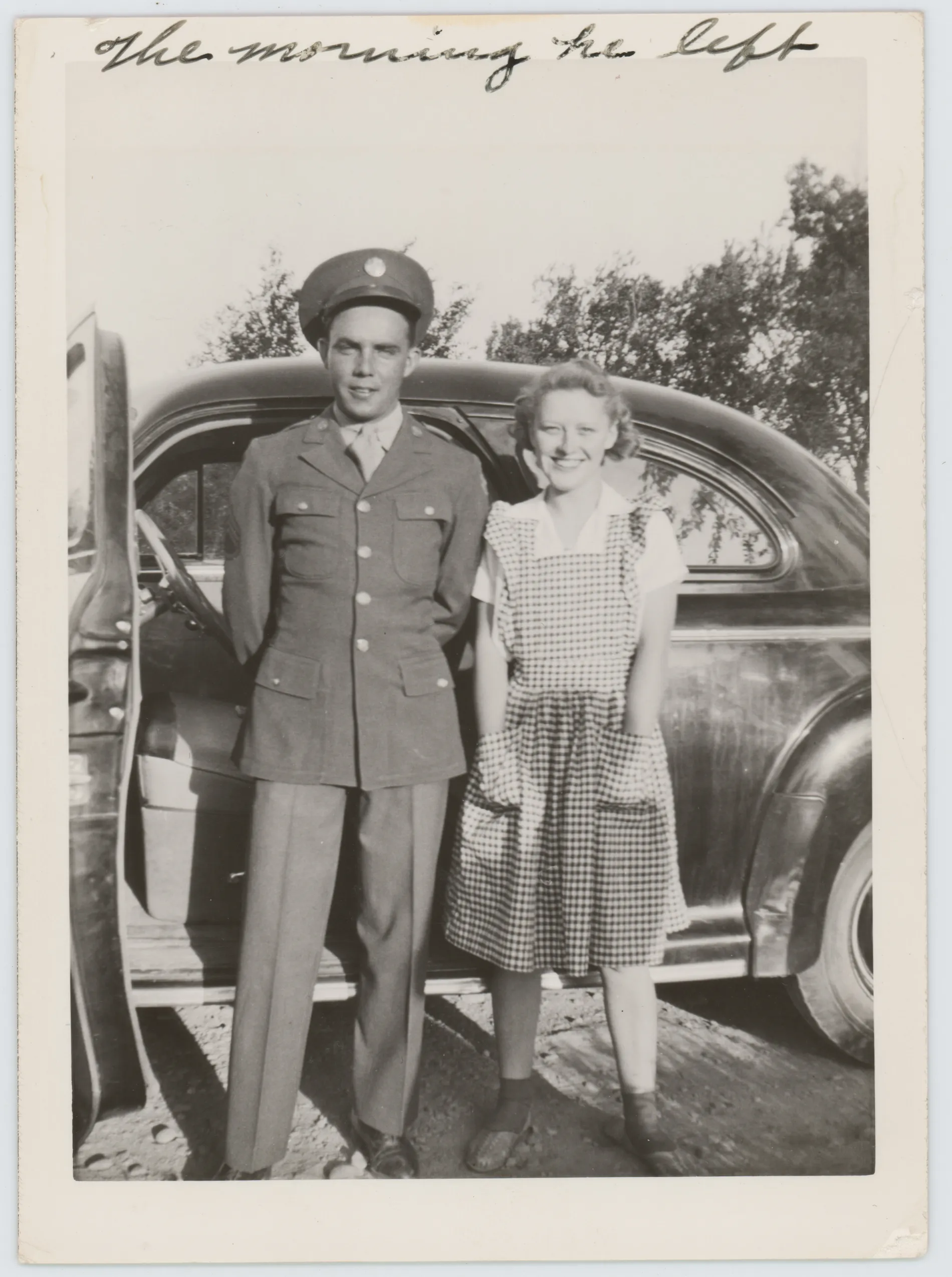 This photograph depicts Oscar Allison and an unknown girl standing next to a car.