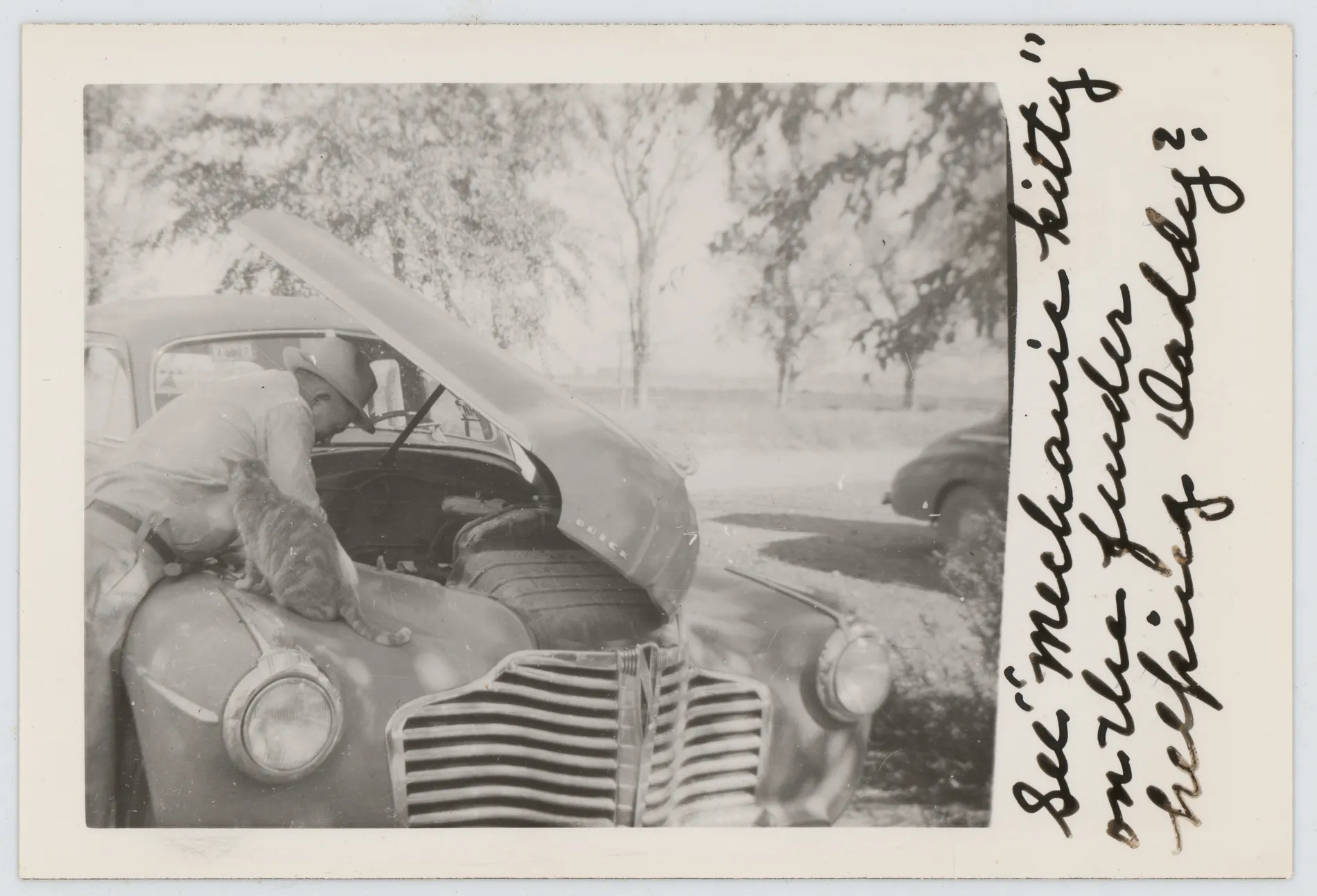 Wiley Grizzle, from [Photograph of Wiley Grizzle working on a car]