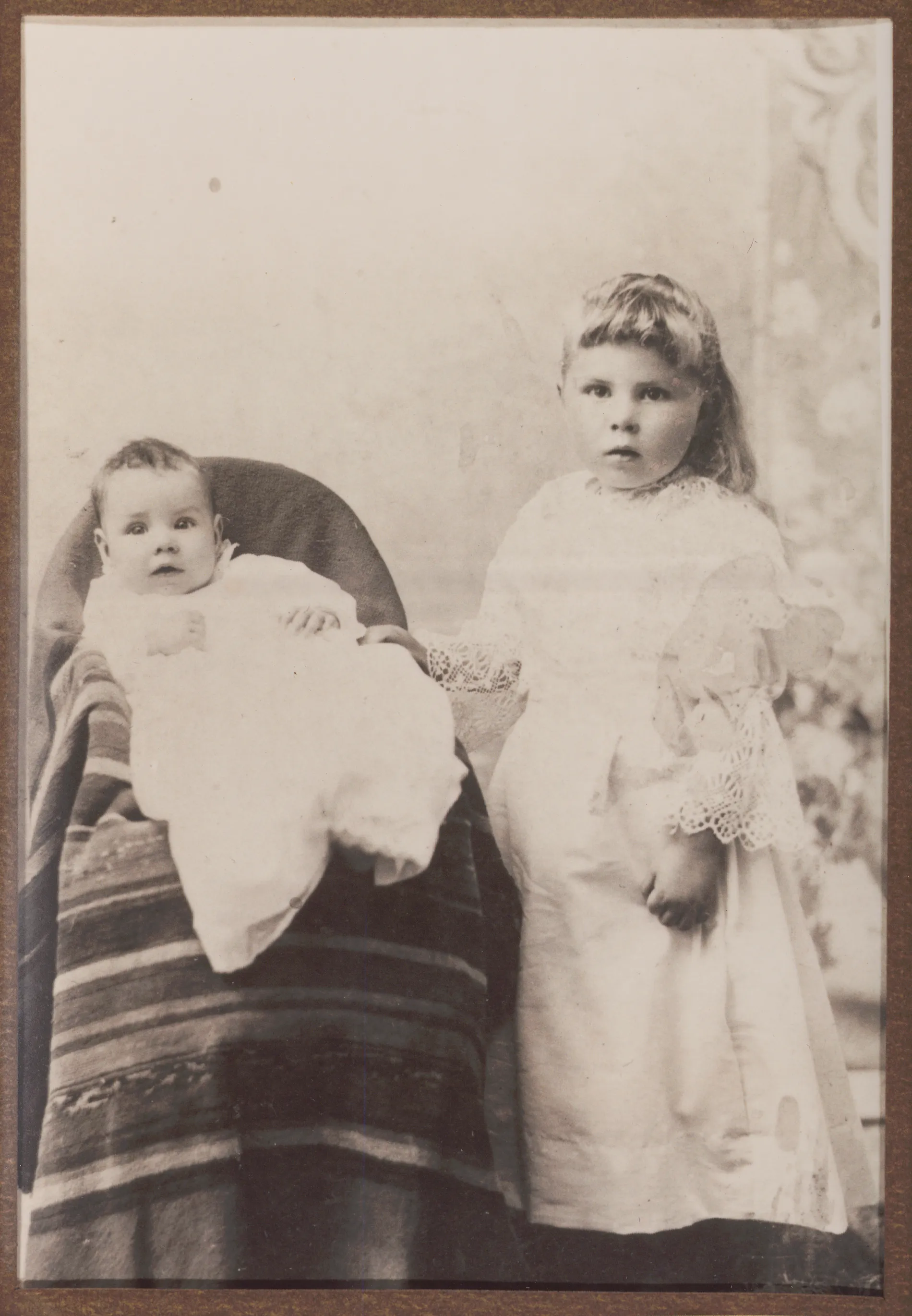 This photograph depicts Ollie and Gladys Ingle in about the year 1896. The location of where this photograph was taken is unknown.