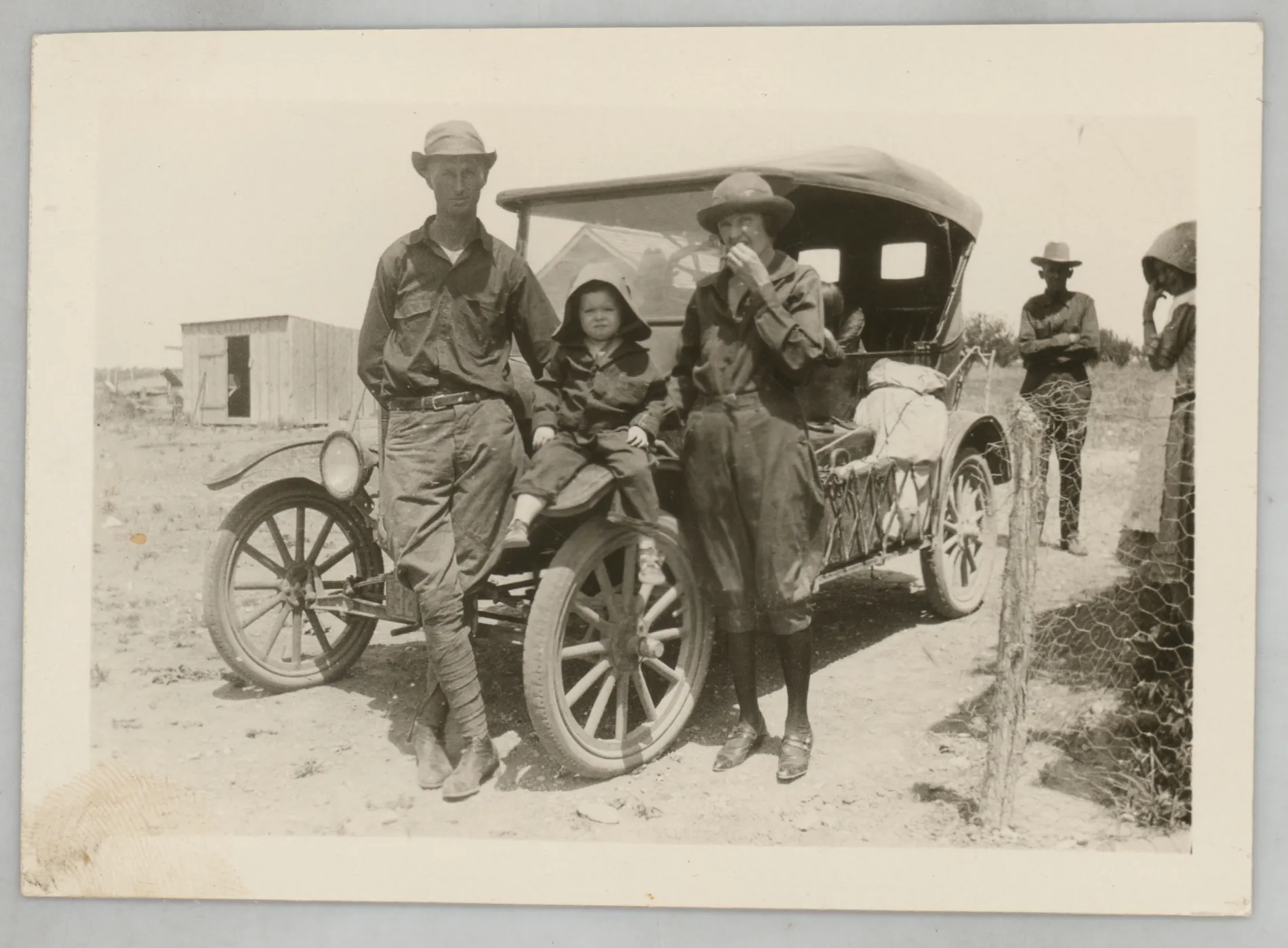 Kenneth Foster, from [Kenneth and Lucille Foster with their daughter, Camille, next to a car]