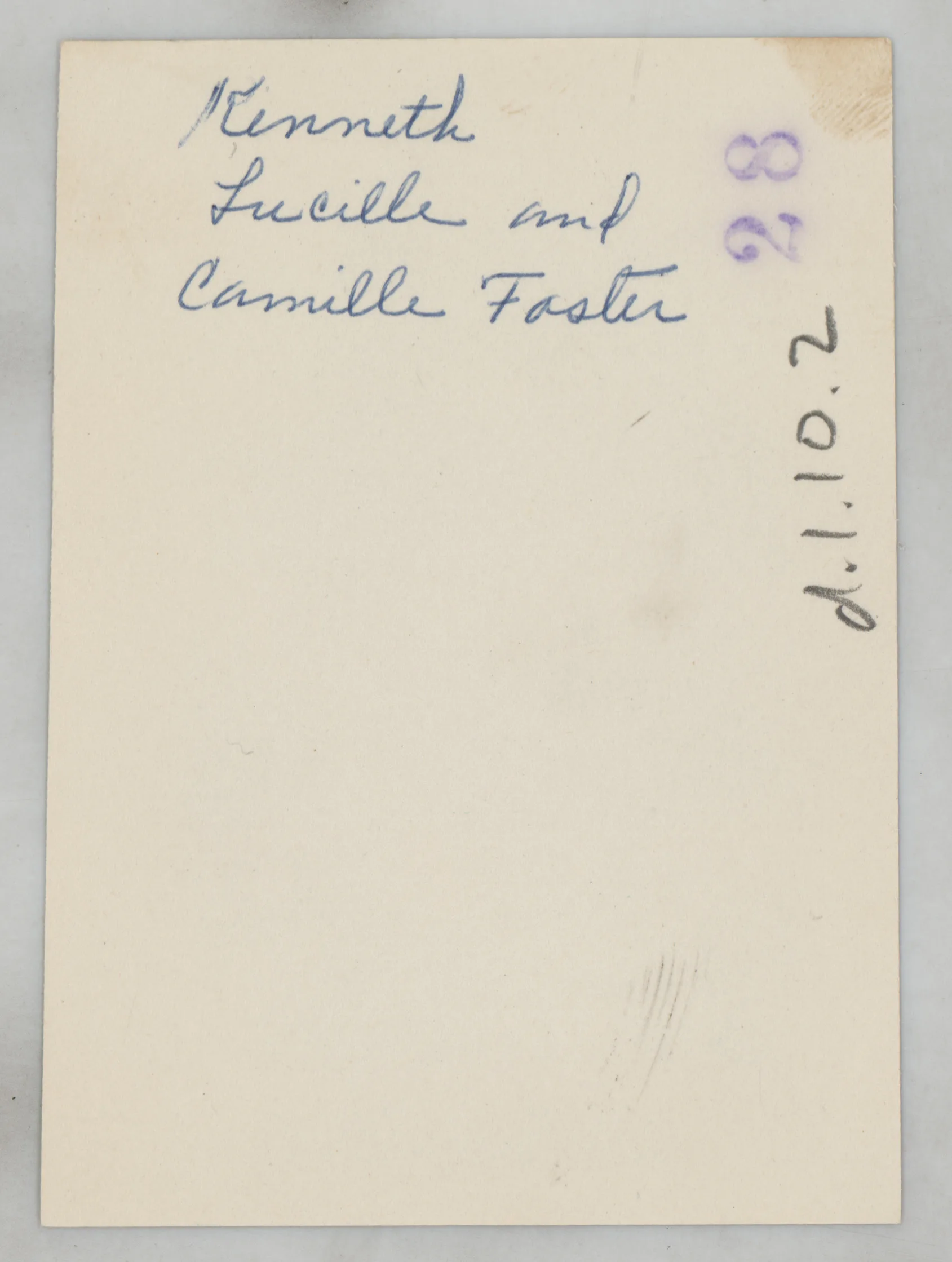 Verso: [Kenneth and Lucille Foster with their daughter, Camille, next to a car]