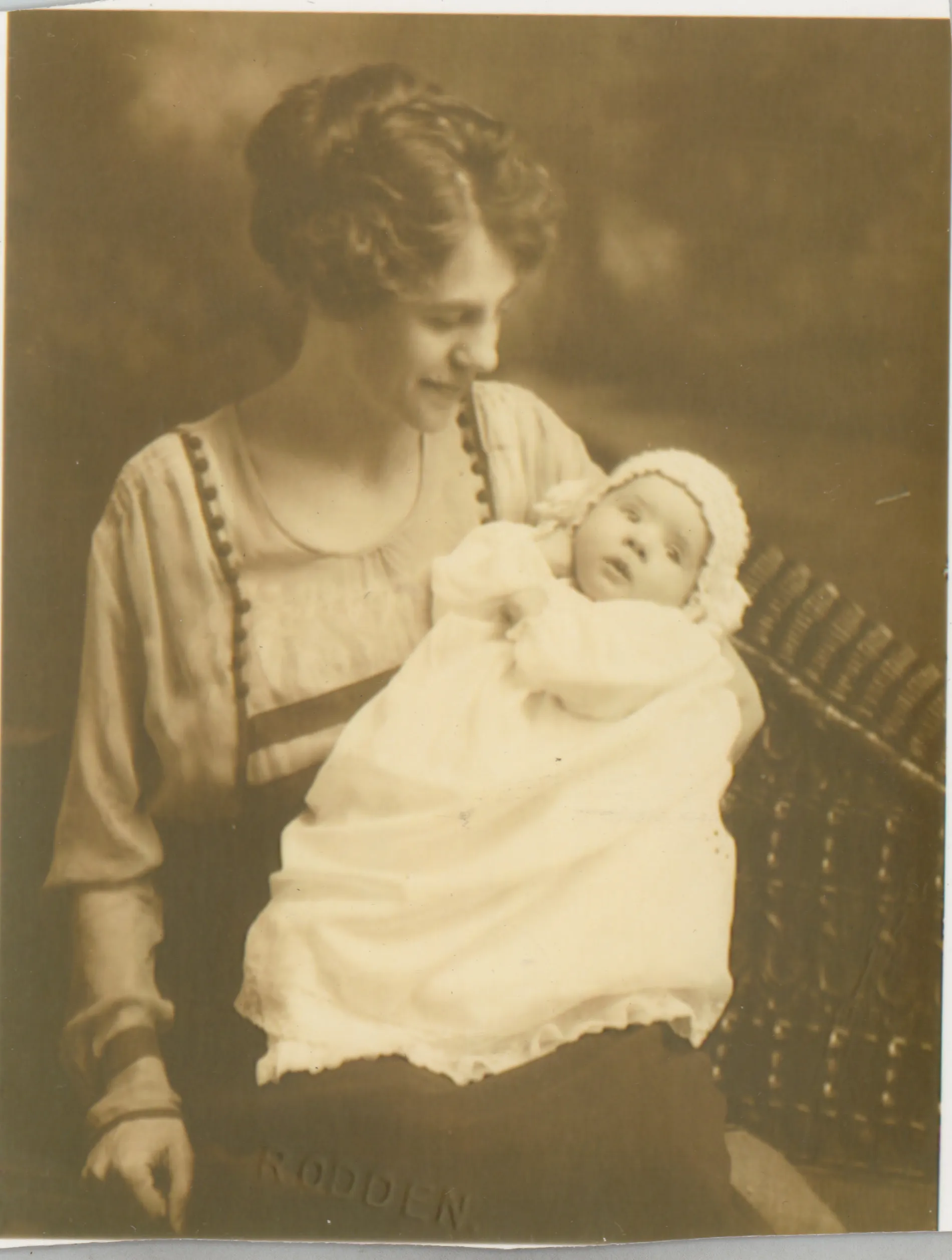 This photograph depicts Loveta McKinstry holding her daughter Sammy as young infant.