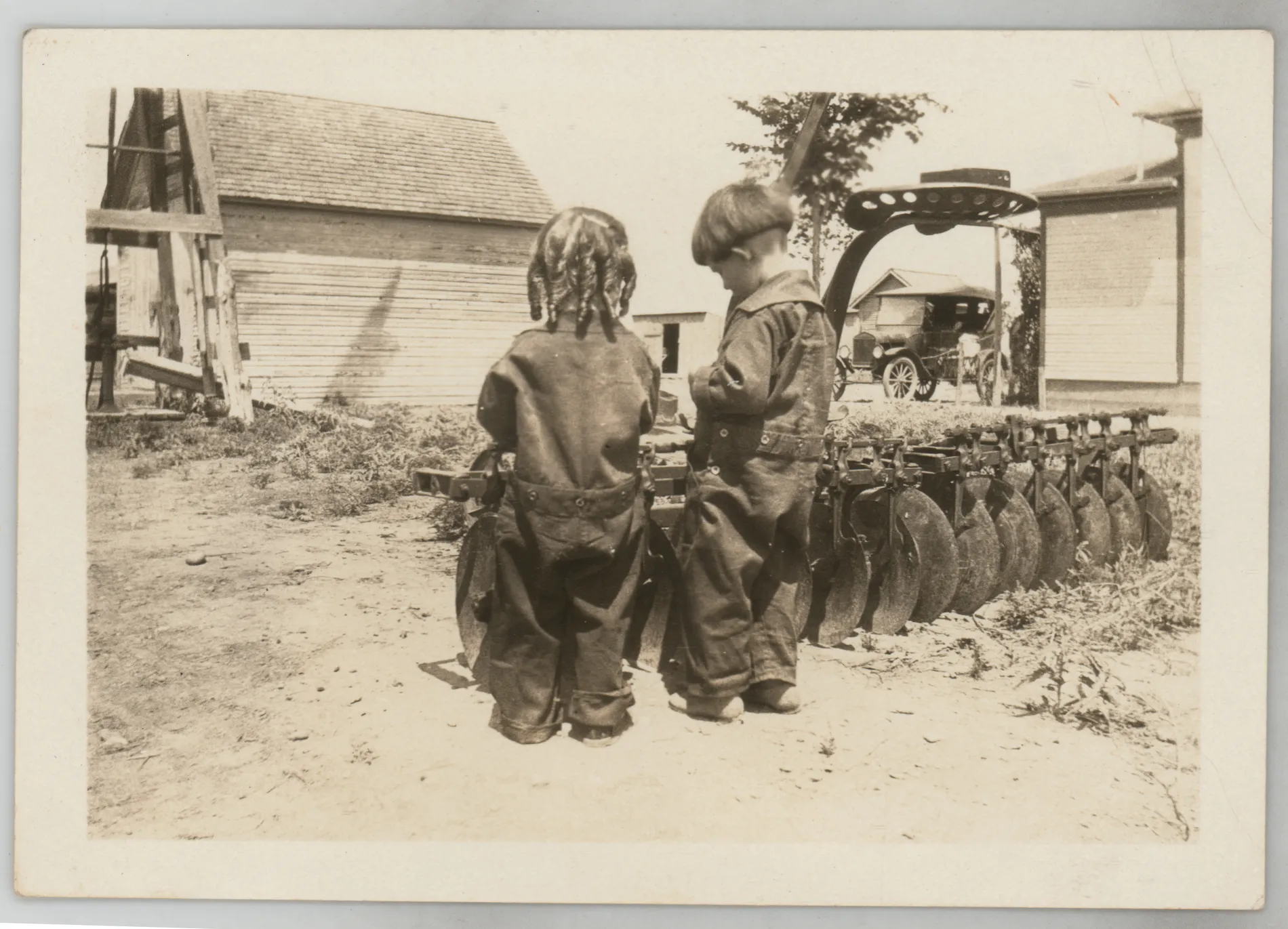 Camille Susan Foster Cowdin, from [Sammy McKinstry and Camille Foster near farm equipment]