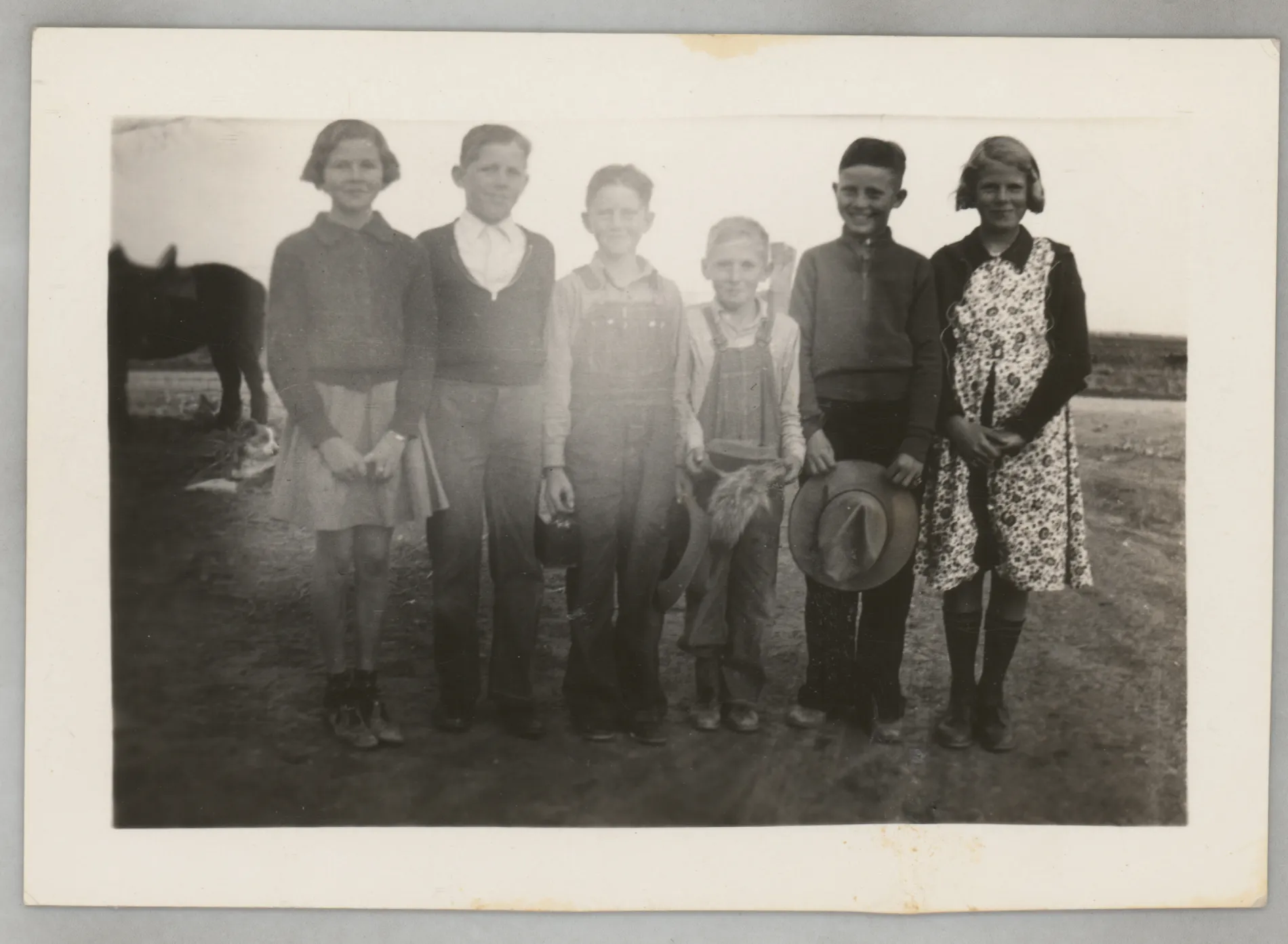This photograph depicts Sammy McKinstry with a small group of friend. The others are unidentified.