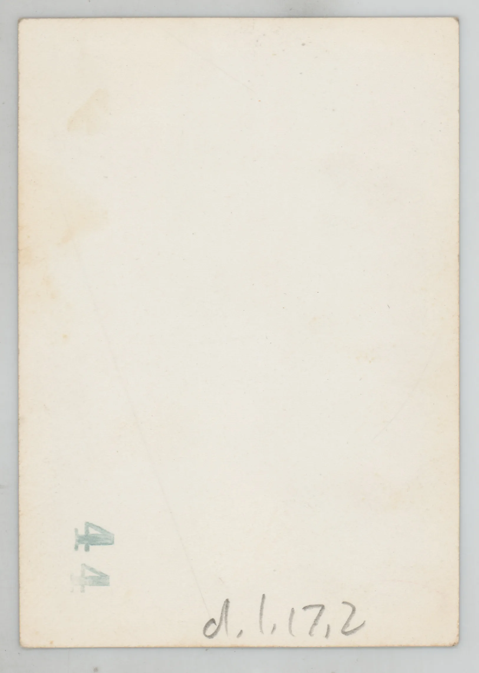 Verso: [Sammy McKinstry in a dress outside a house]