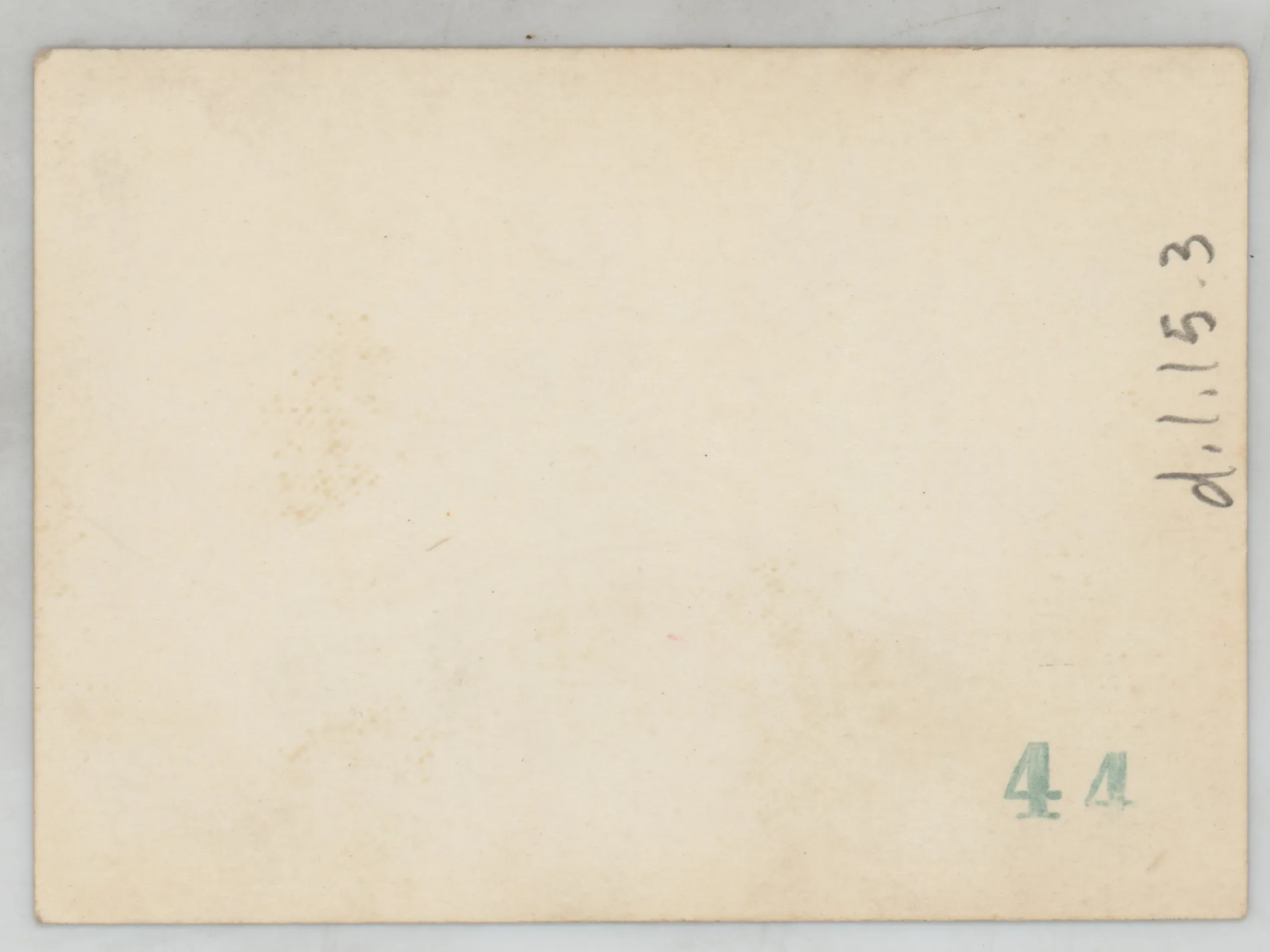 Verso: [Sammy McKinstry in a dress outside a house]