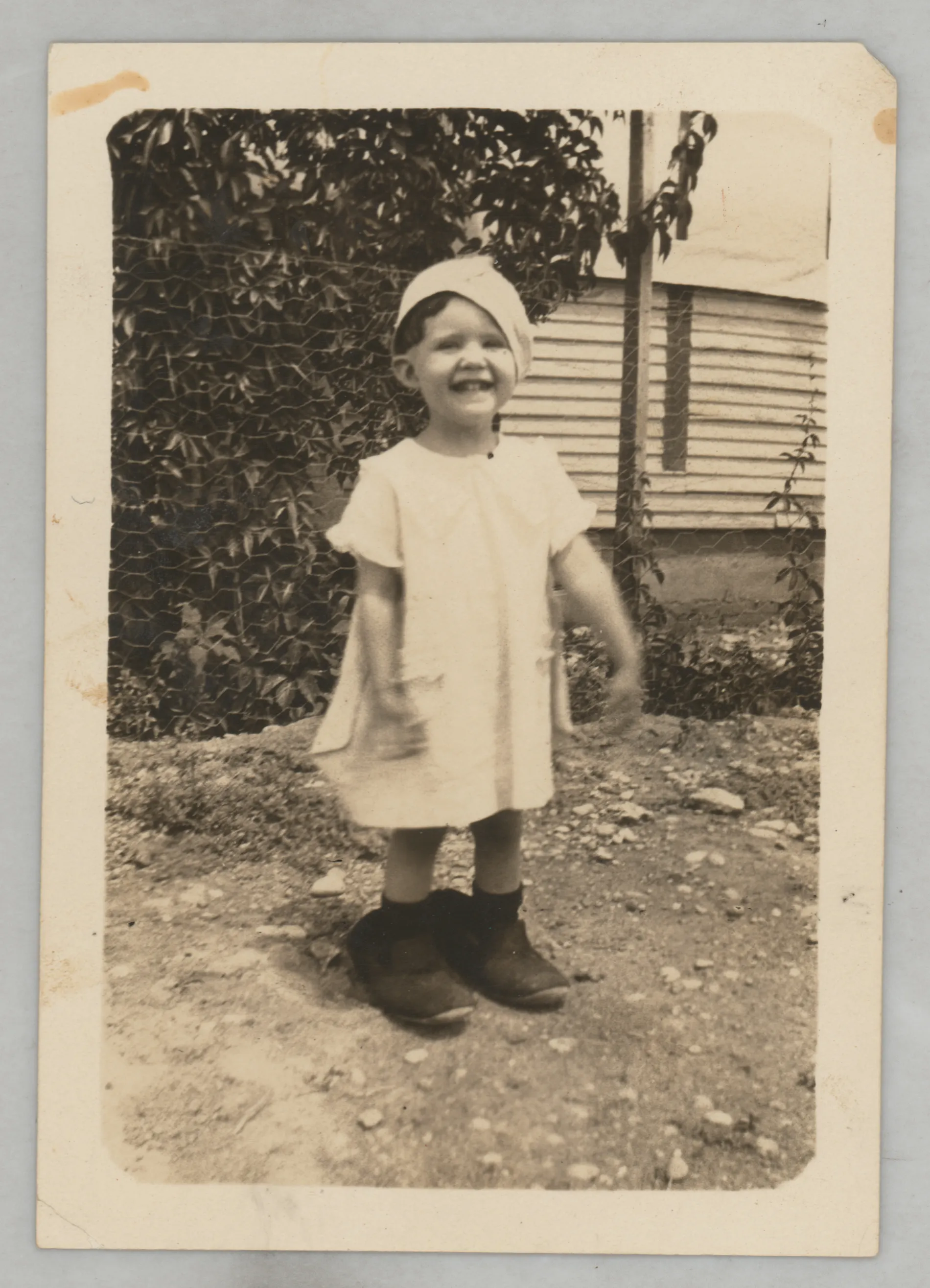 This photograph depicts Sammy McKinstry around the age of 2 or 3 wearing a hat and oversized shows. It is possible that these shows might match those Austin Swann was wearing in this time period. See related picture..