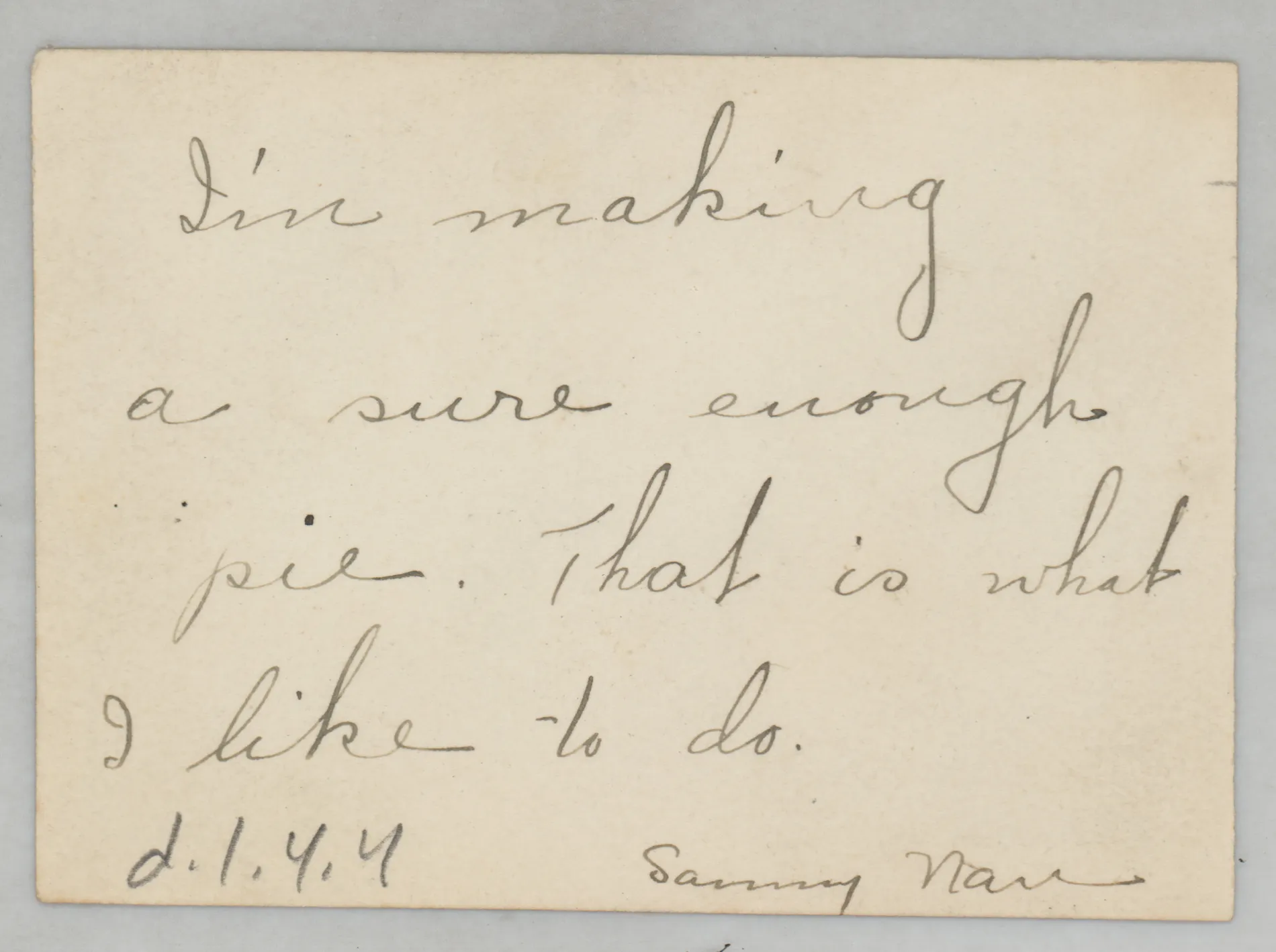 Verso: [Sammy McKinstry pretending to cook]
