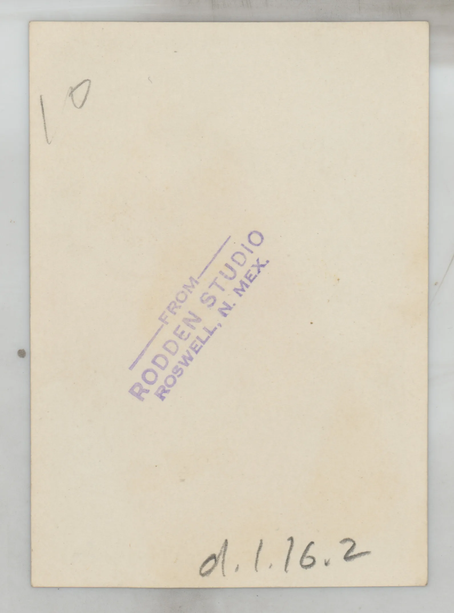 Verso: [Sammy McKinstry and Sara Beth West standing next to house]