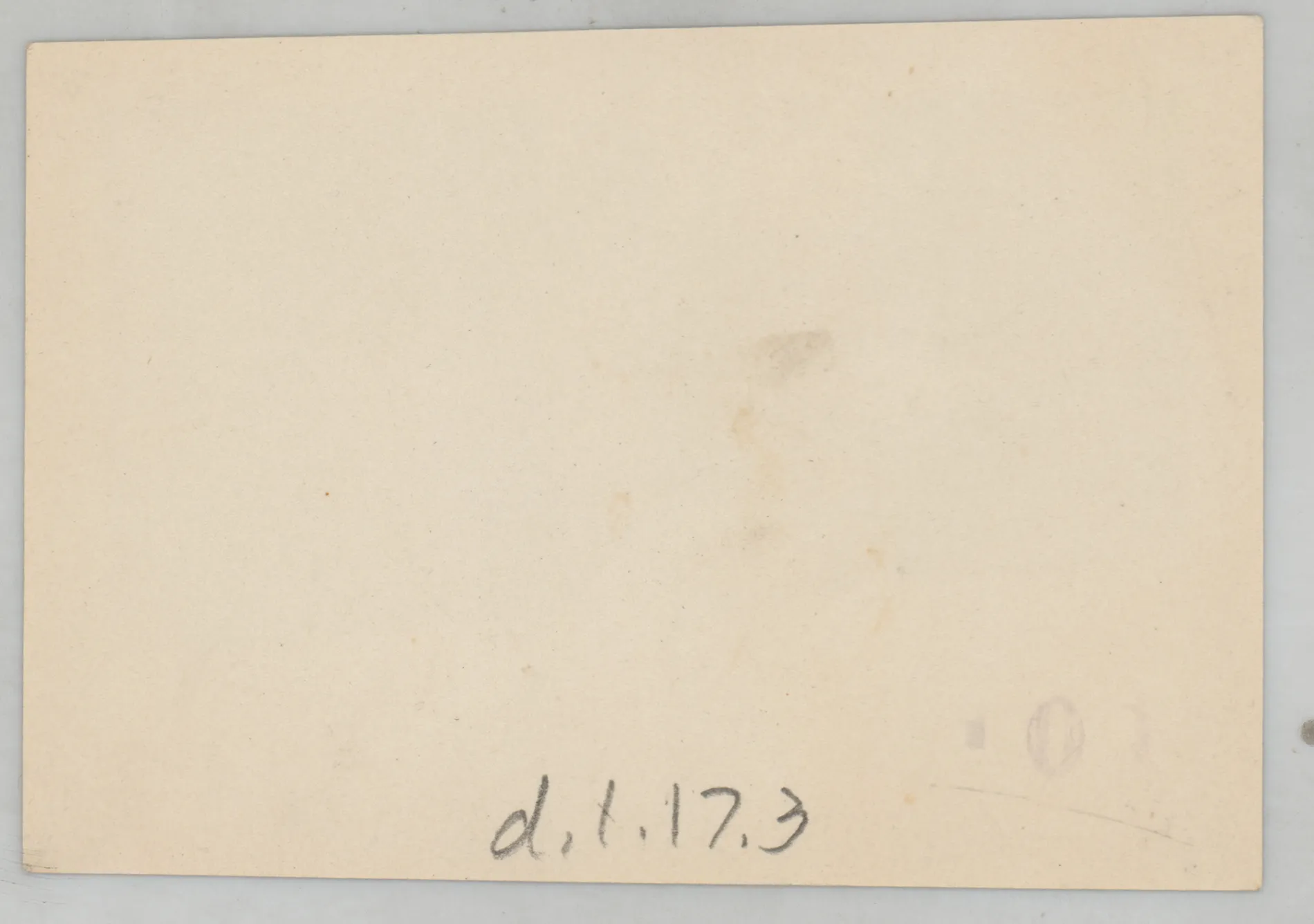 Verso: [Sammy McKinstry laying on ground with two boys]
