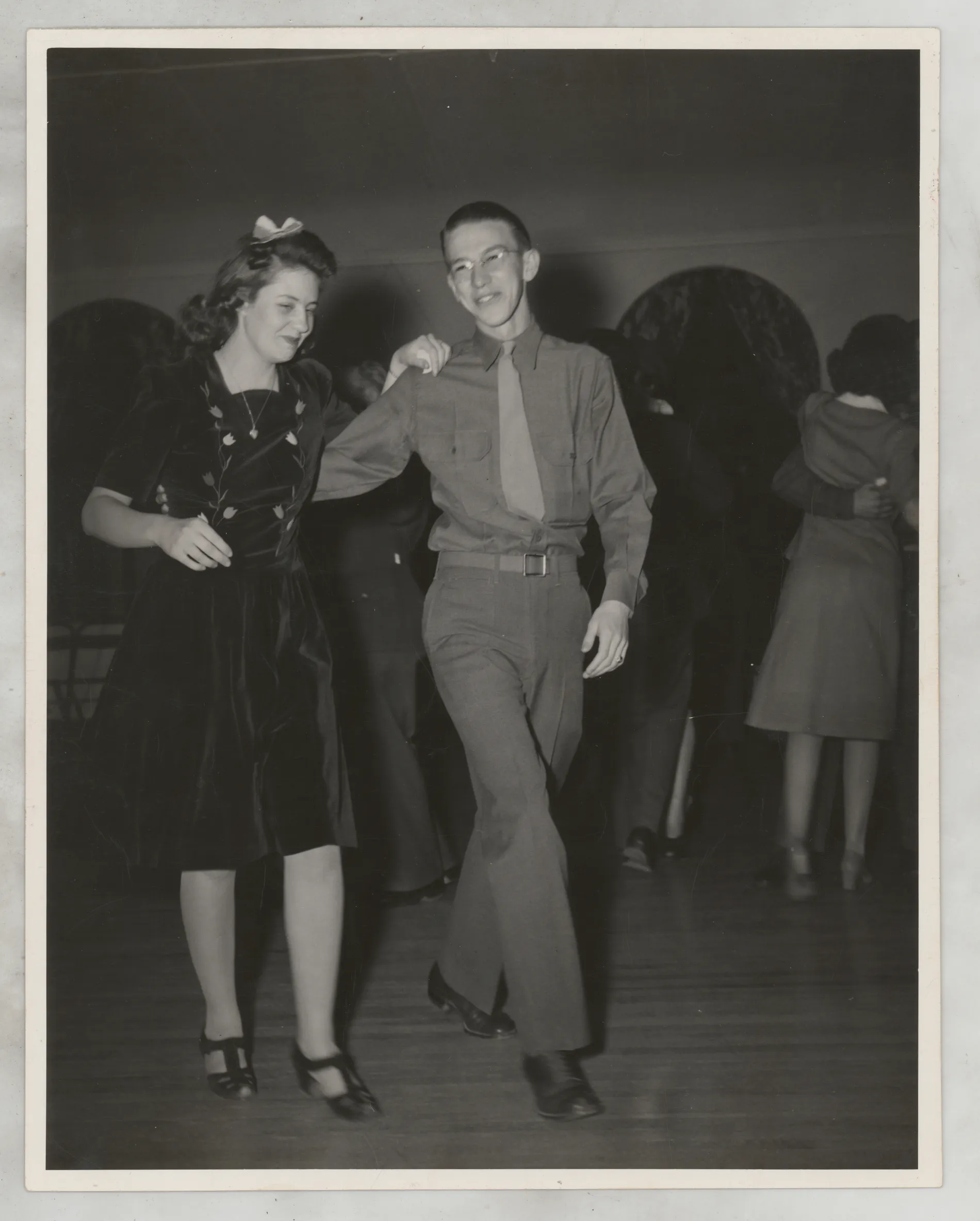 This photograph depicts Jean McKisntry (left) and Frank Lajdziak (right) dancing together at some type of social event.
