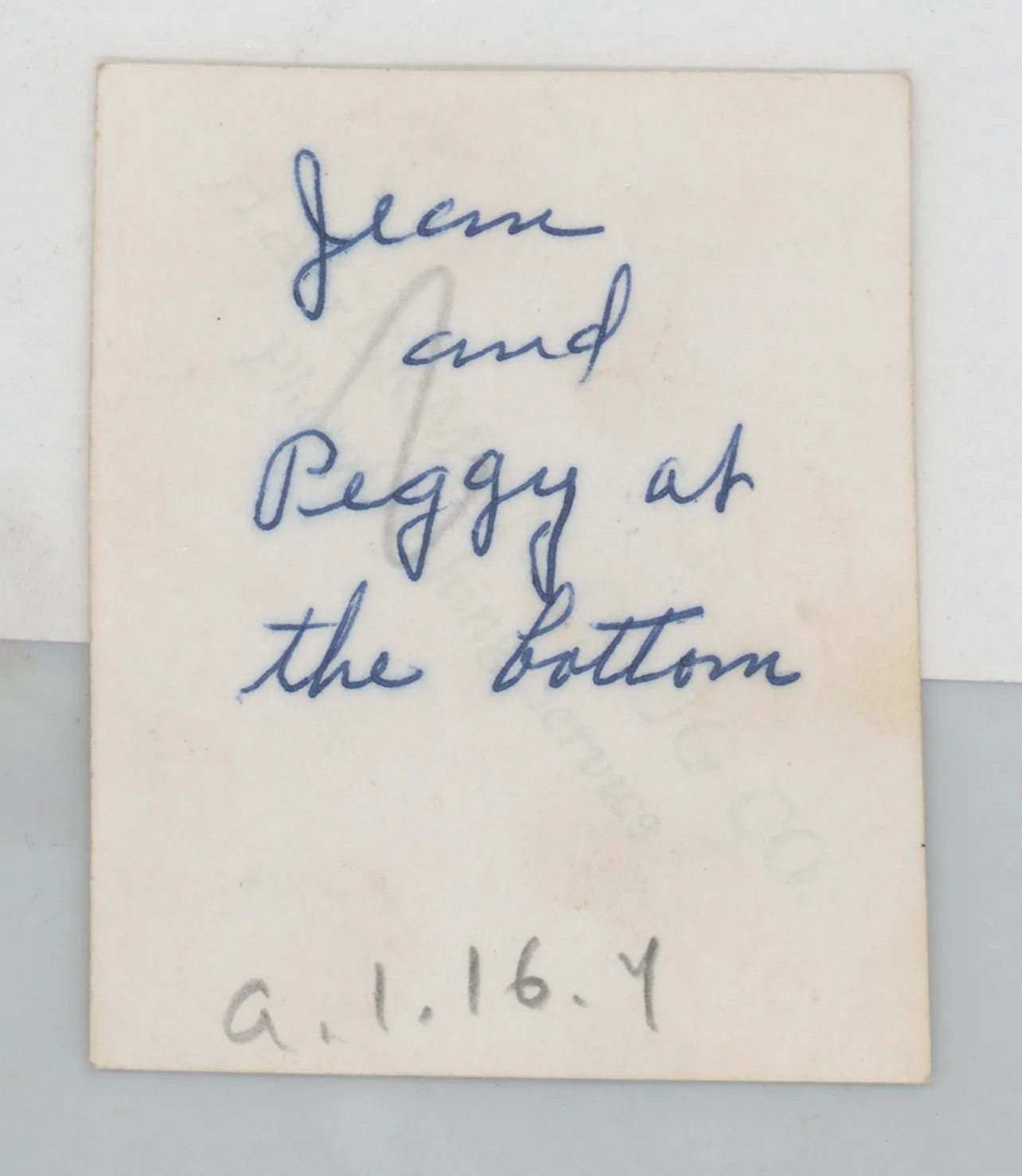 Verso: [Jean and Peggy McKinstry standing next to a tree]