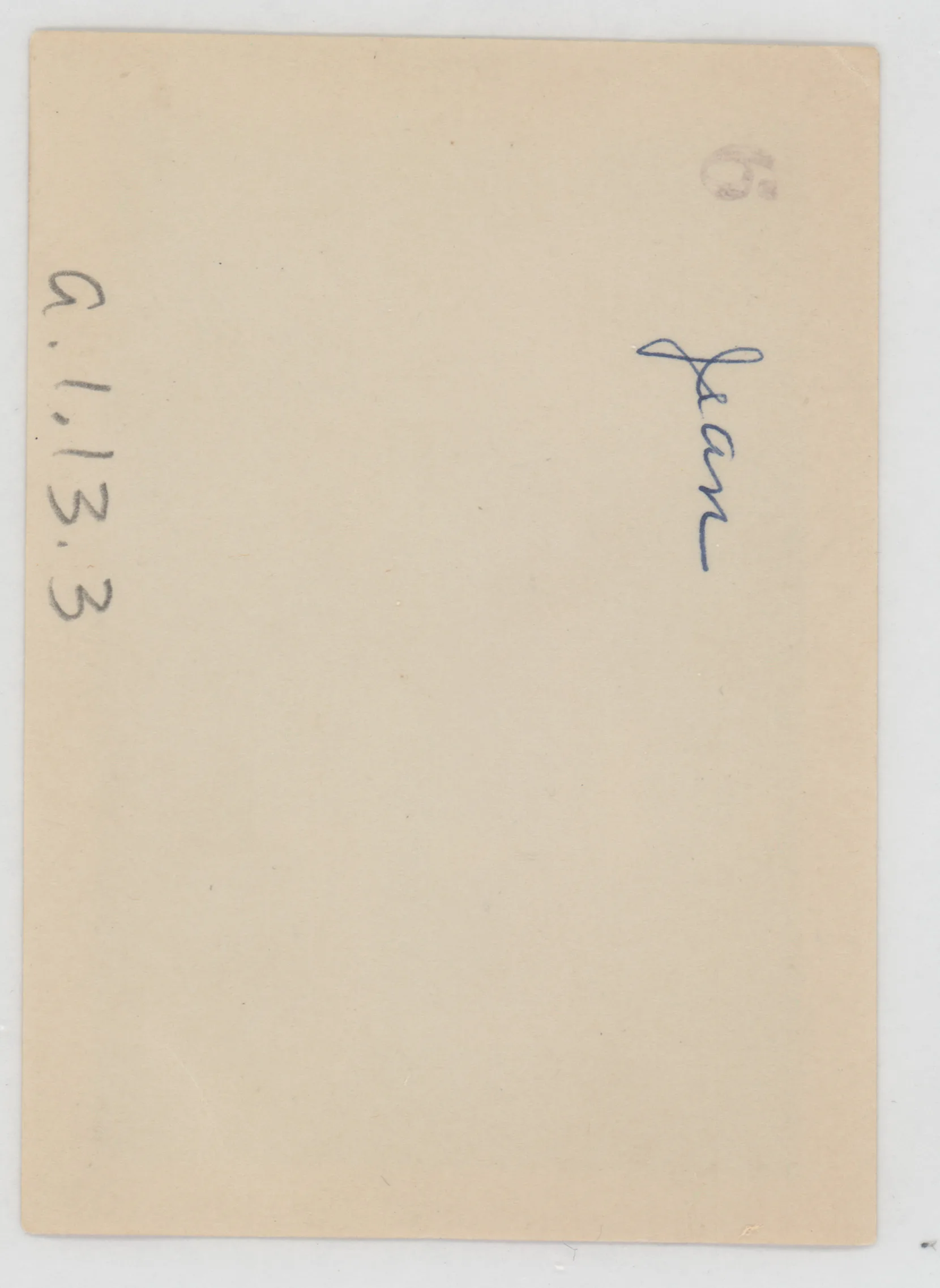 Verso: [Jean McKinstry next to rocking chair]