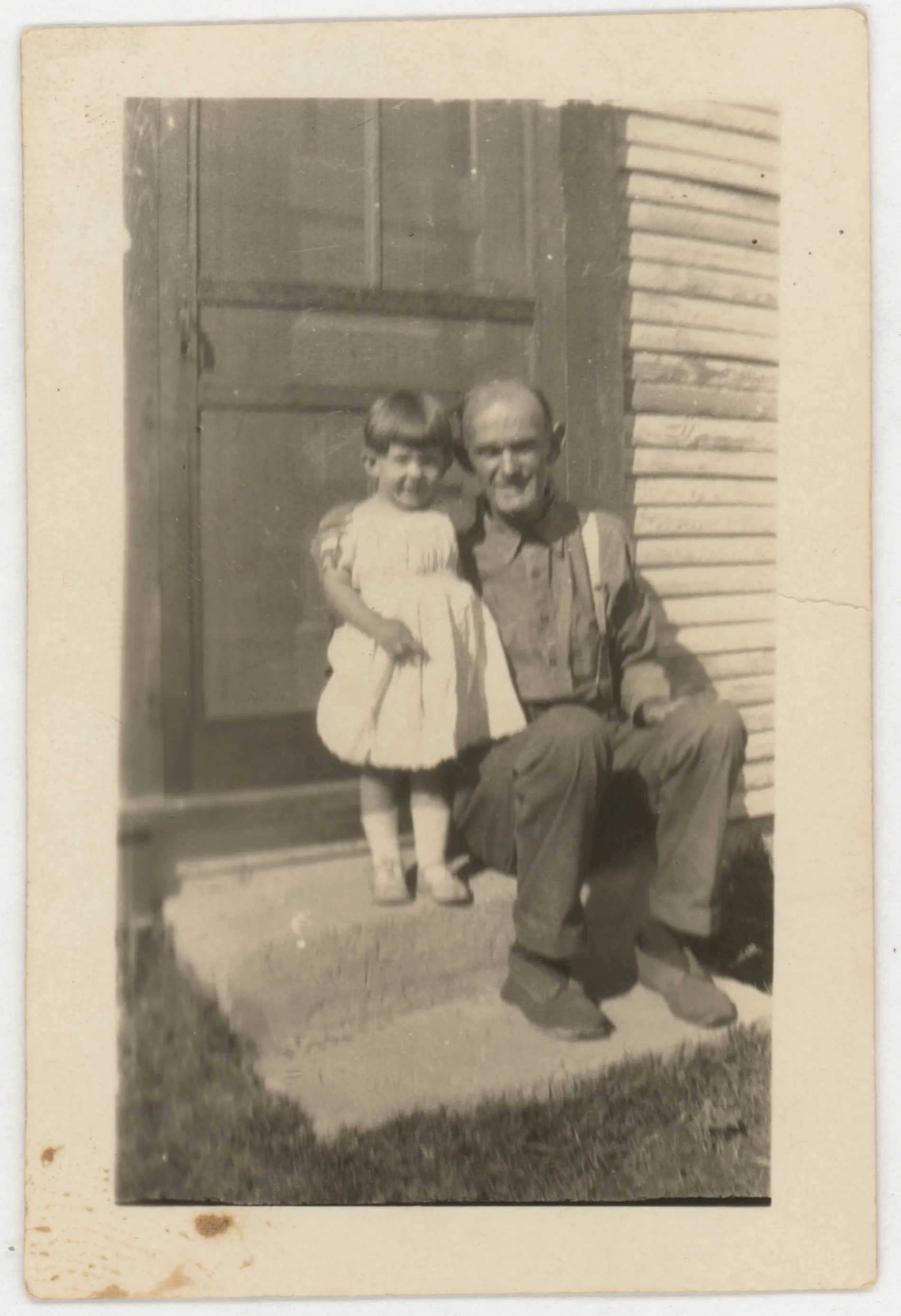 This is a photograph of Veta Jean McKinstry and Austin Swann. Jean is wearing the baby dress of Austin Swann in this image.