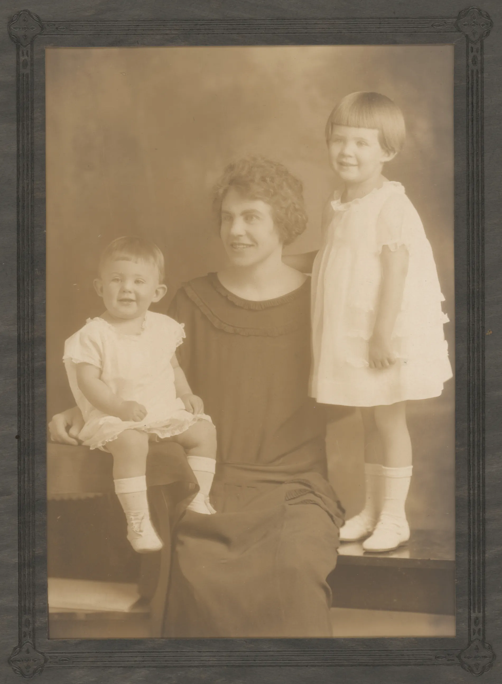 This formal portrait depicts Loveta Swann McKinstry with her daughters, Sammy Nan and Veta Jean, around the year 1924.