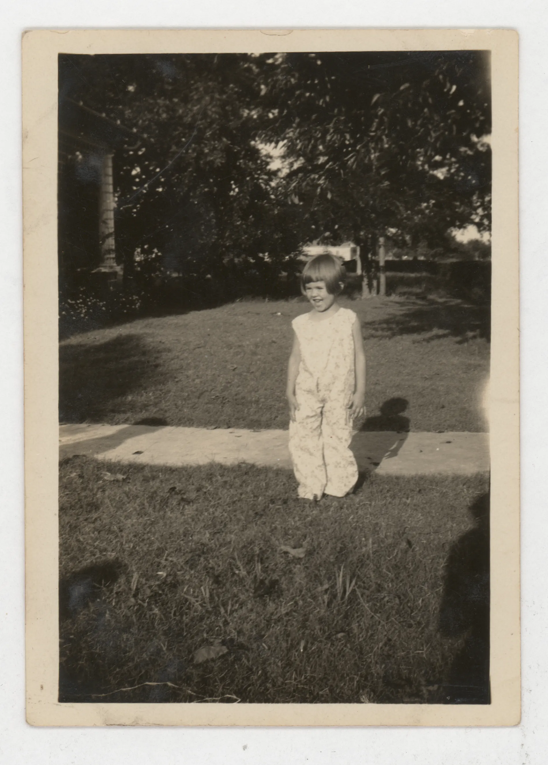 This photograph depicts Mildred McKinstry at Charley and Nannie Girdner's home in Jacobia, Texas.