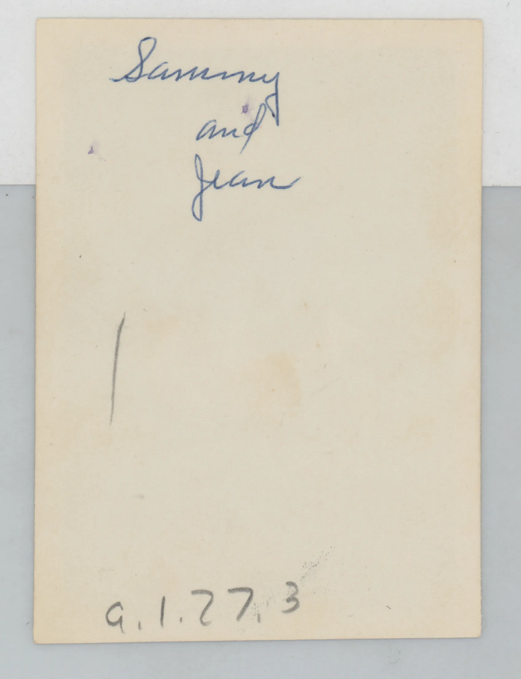 Verso: [Sammy and Jean McKinstry on a porch]