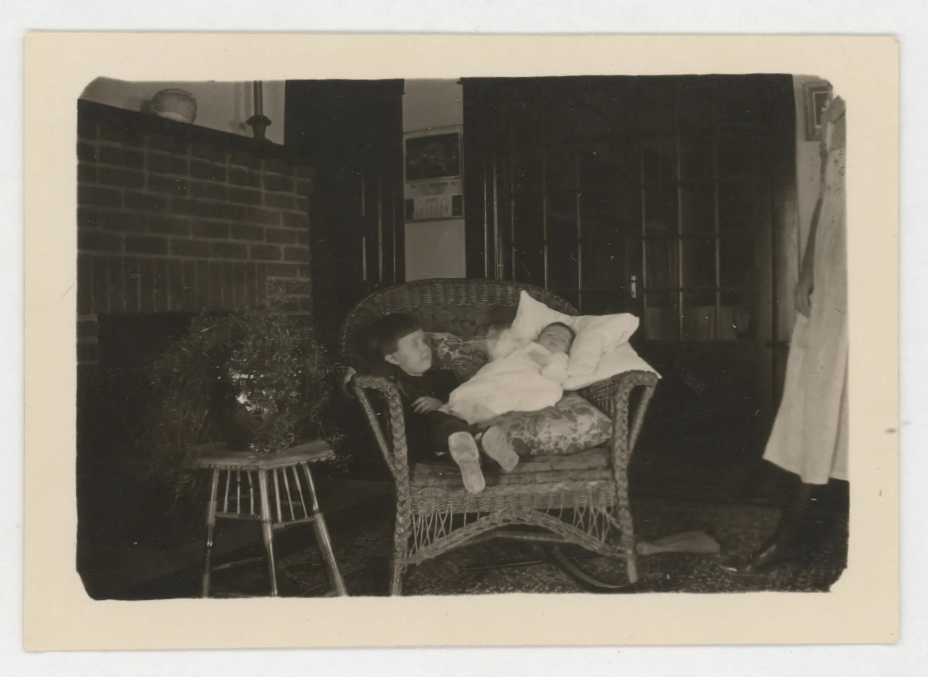 This photograph depicts Sammy and Jean McKinstry sitting on a chair.