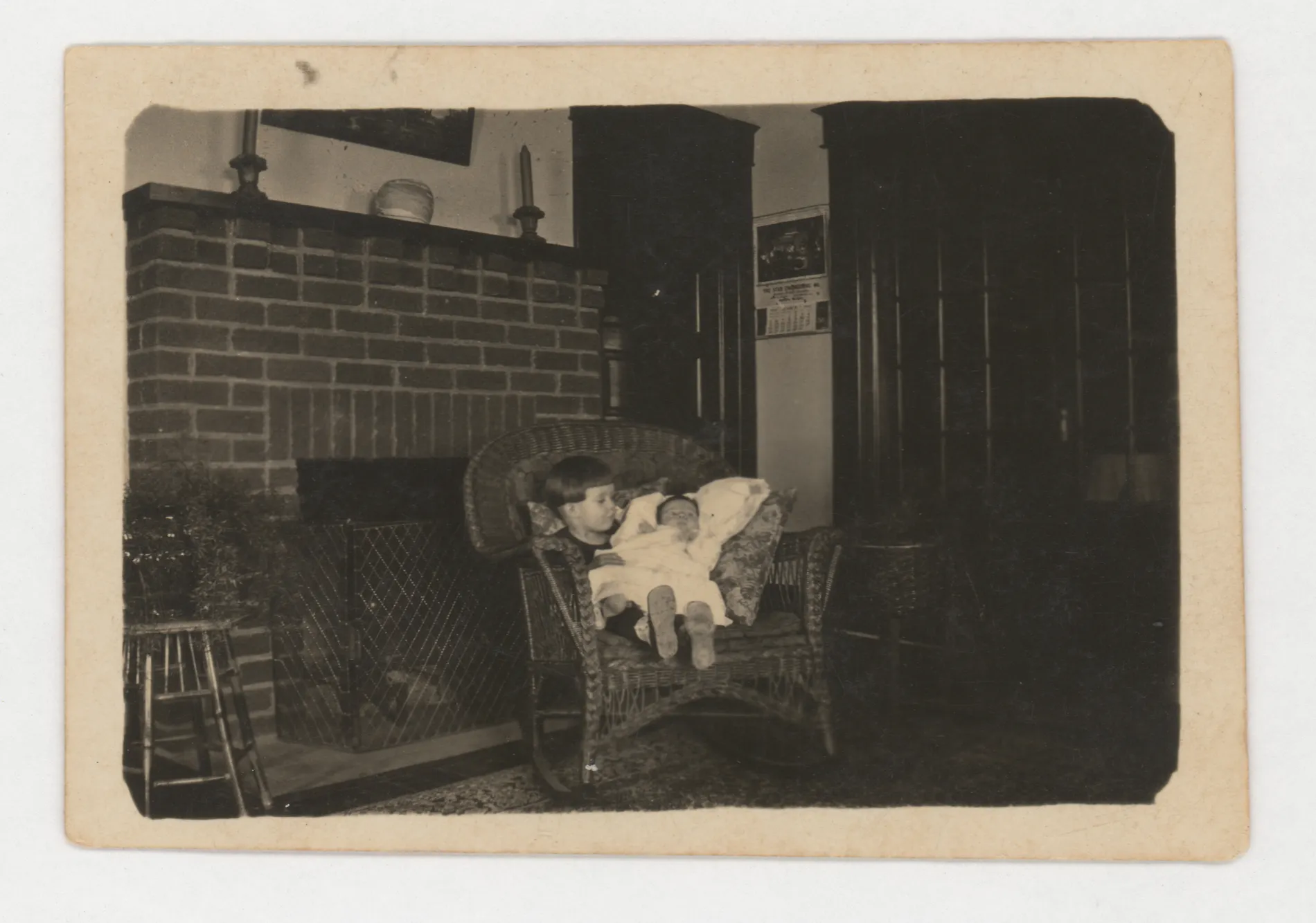 This photograph depicts Sammy and Jean McKinstry sitting on a chair.