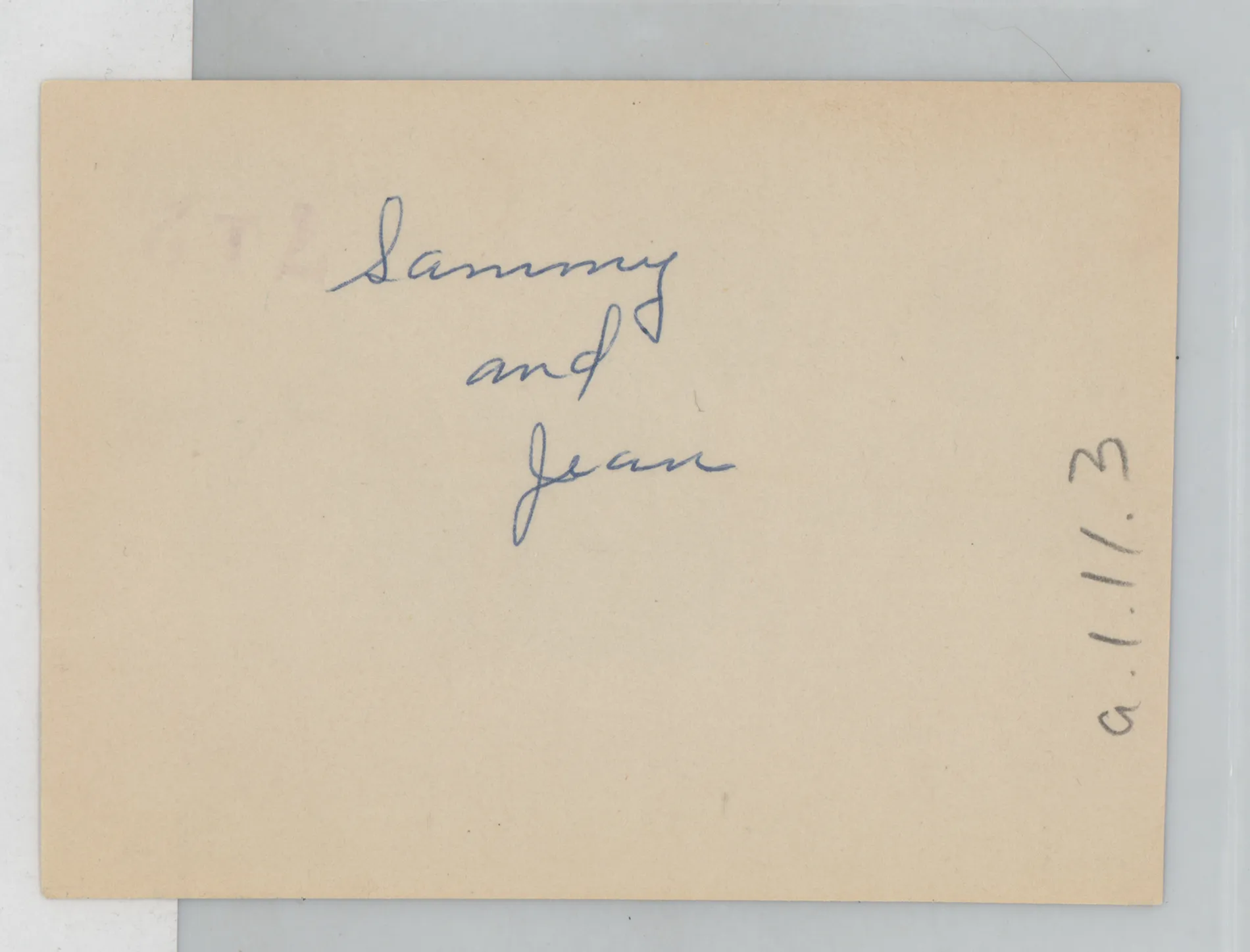 Verso: [Sammy and Jean Mckinstry with flowers]