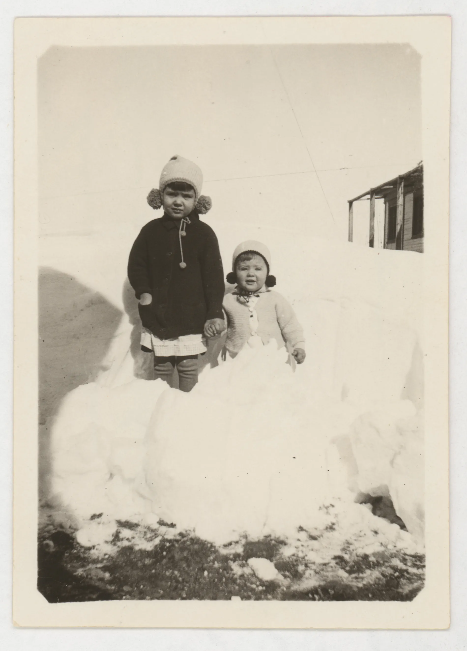 This photograph depicts Sammy and Jean McKinstry standing in a snow bank. The location of this photograph is unidentified, but it was likely taken in Hagerman.