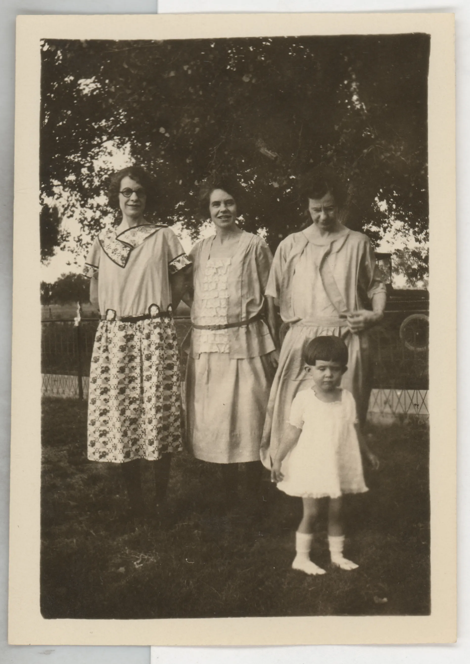 This is a snapshot depicting Minnie McKinstry, Loveta McKinstry, Eva West, and Sammy McKinstry. This photograph was likely taken in Hagerman, New Mexico in 1922.