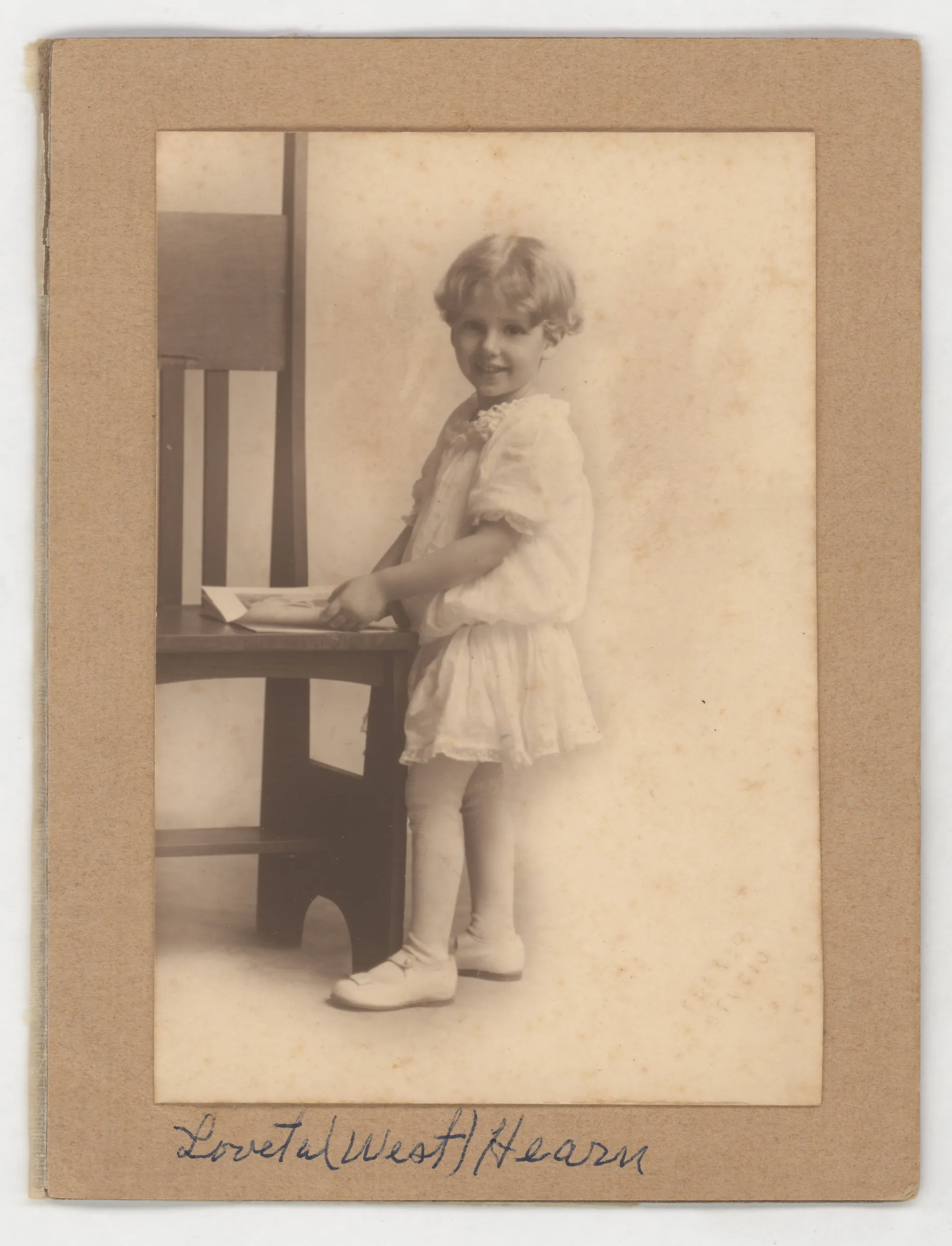 This photograph depicts Loveta West, the daughter of Tollie and Edith West. She appears to be about four years old here.