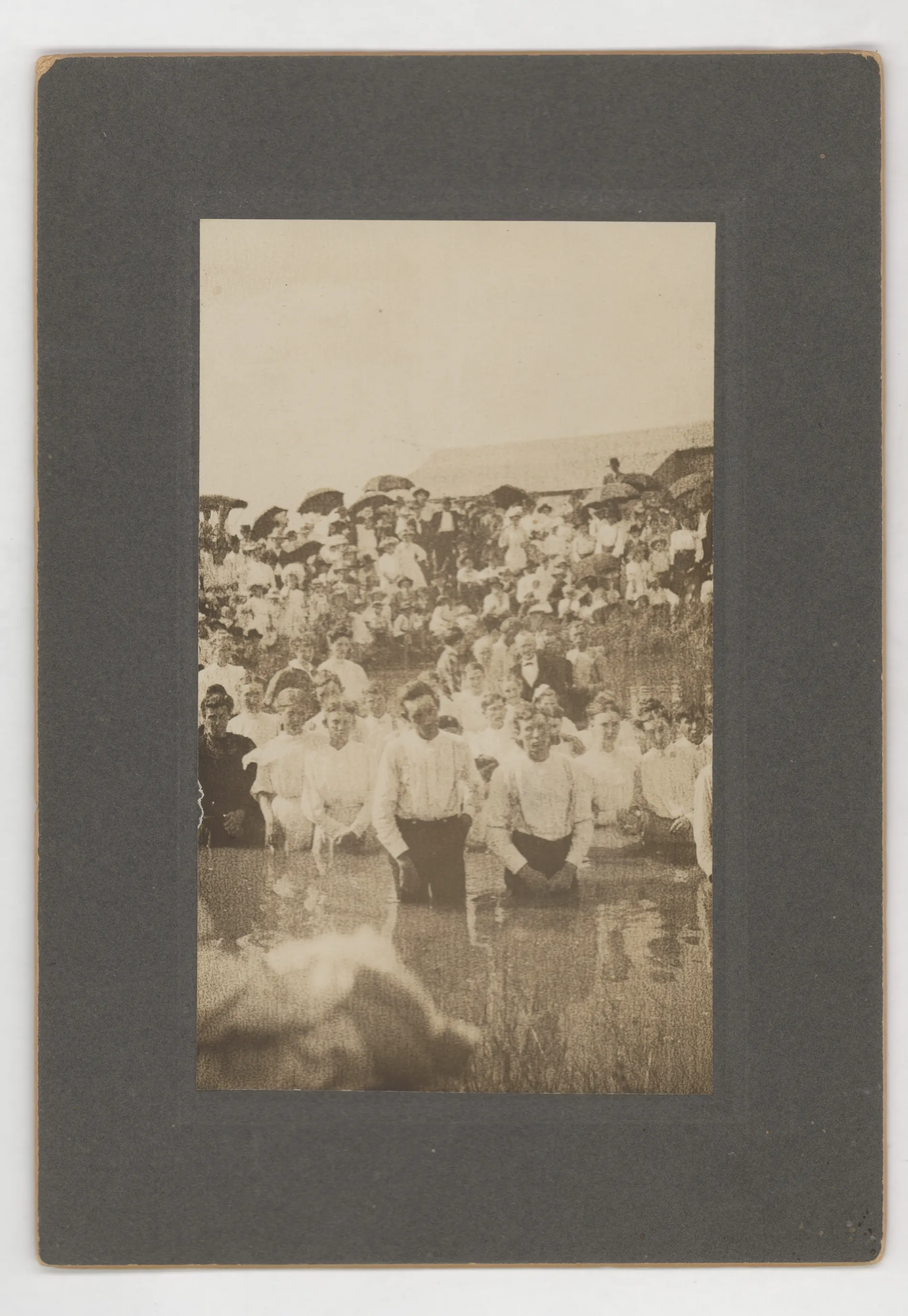 This photograph depicts a Baptist baptism at the Dodson Pool near Jacobia, Texas. Numerous people are in this photograph, but none are identifiable.