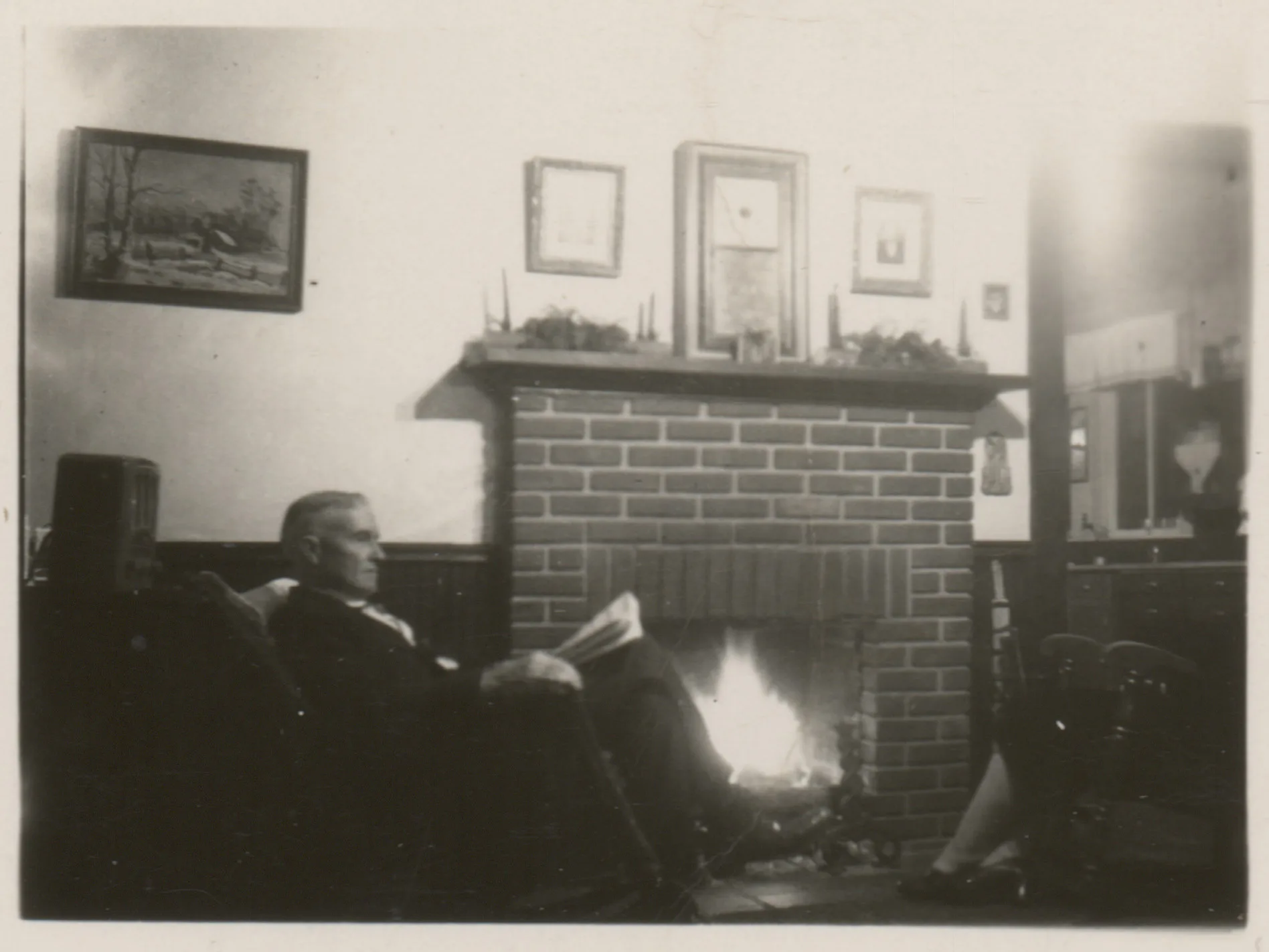 This is a photograph of a seated C.E. Girdner at the home of Sam and Loveta McKinstry. The photograph shows the interior of their home. This was likely taken around 1930.