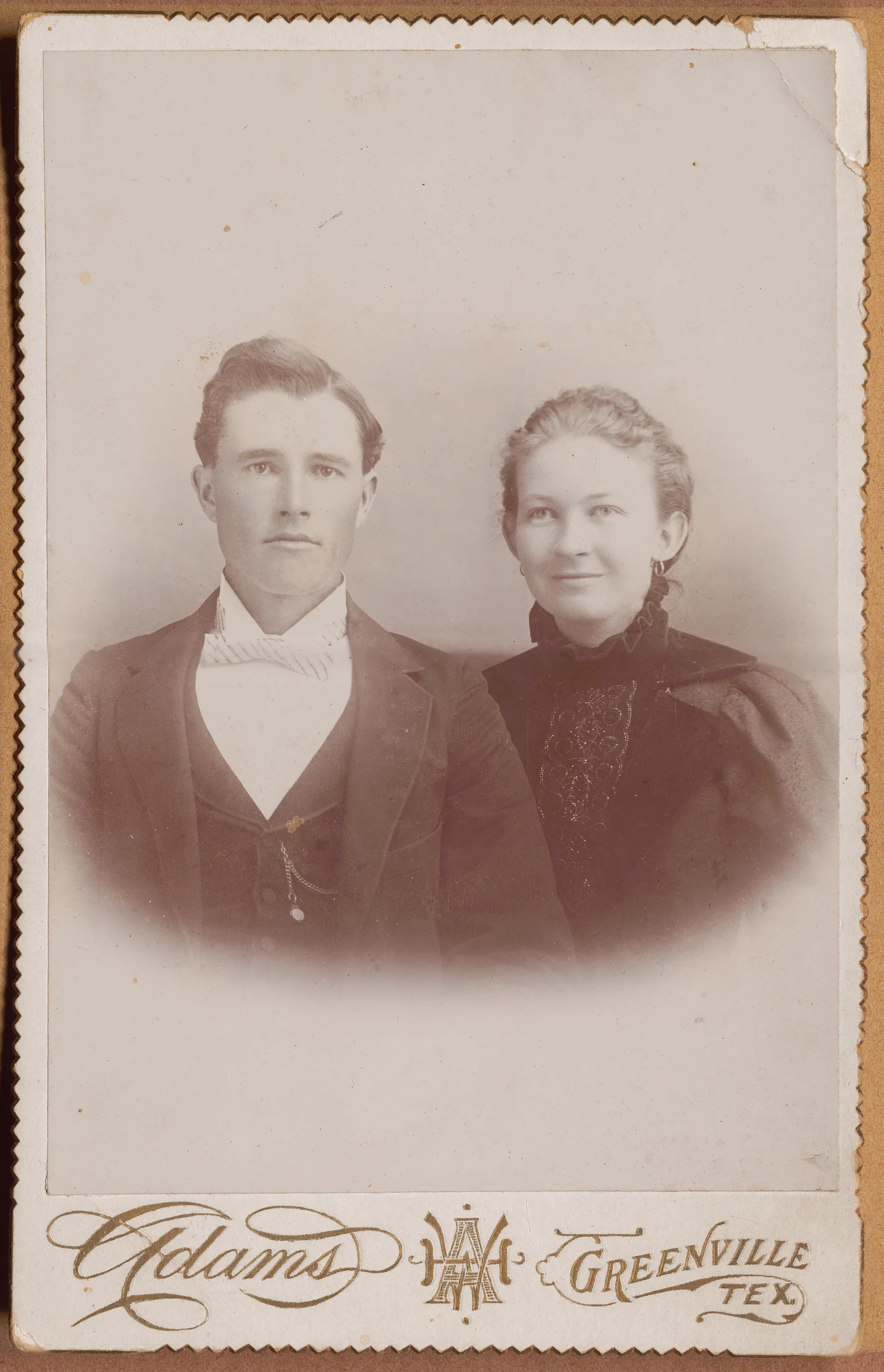 This portrait depicts Charles and Nannie Girdner taken at the Adams Studio in Greenville, Texas. This may be a wedding portrait of each of them, but this is not certain.