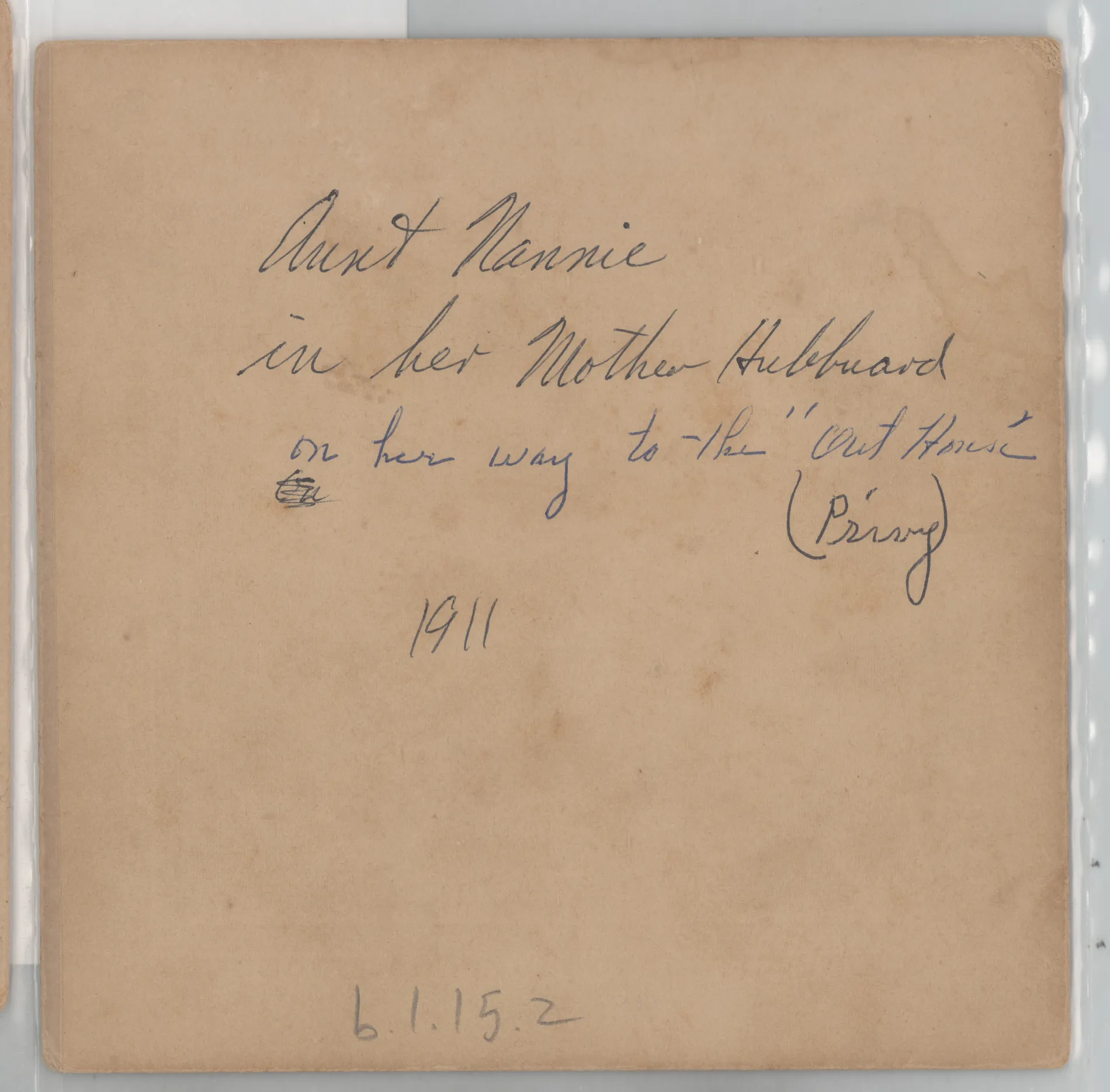 Verso: [Nannie Swann Girdner walking to outhouse]