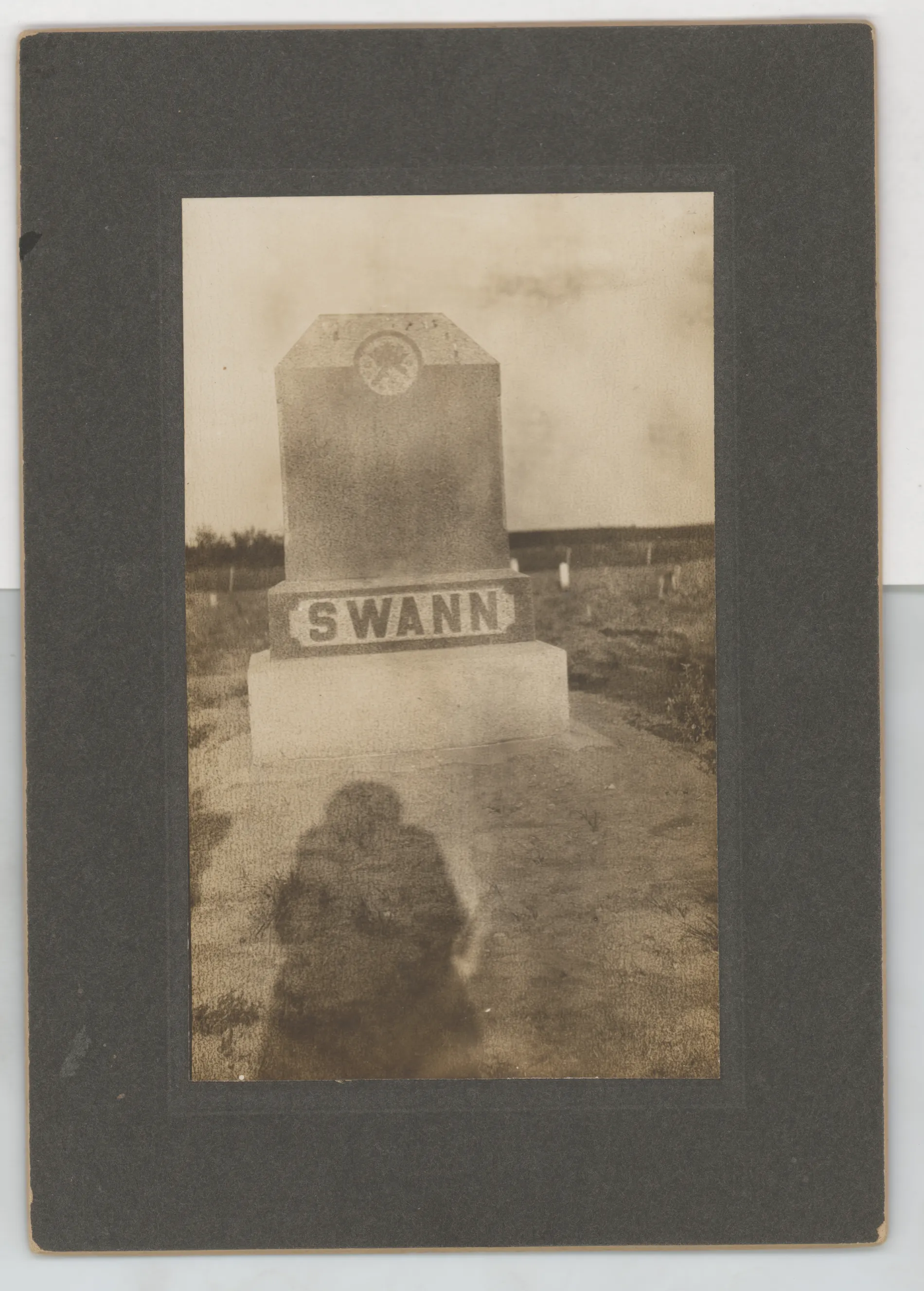 This photograph shows the grave of Austin Swann in the cemetery at Jacobia in Hunt County, Texas.