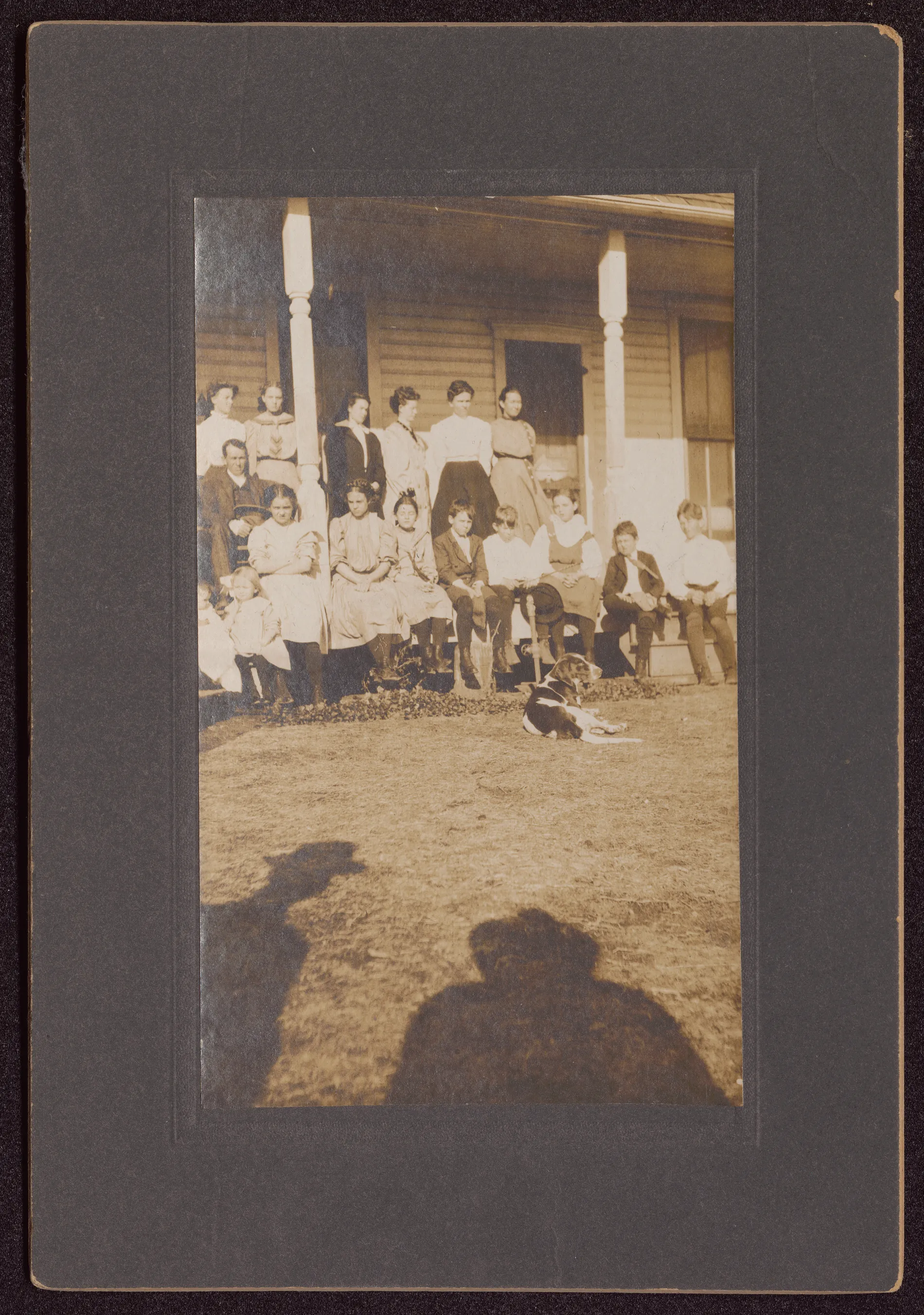 This photograph depicts a group of Swann families on the porch of a Jacobia, Texas home. 