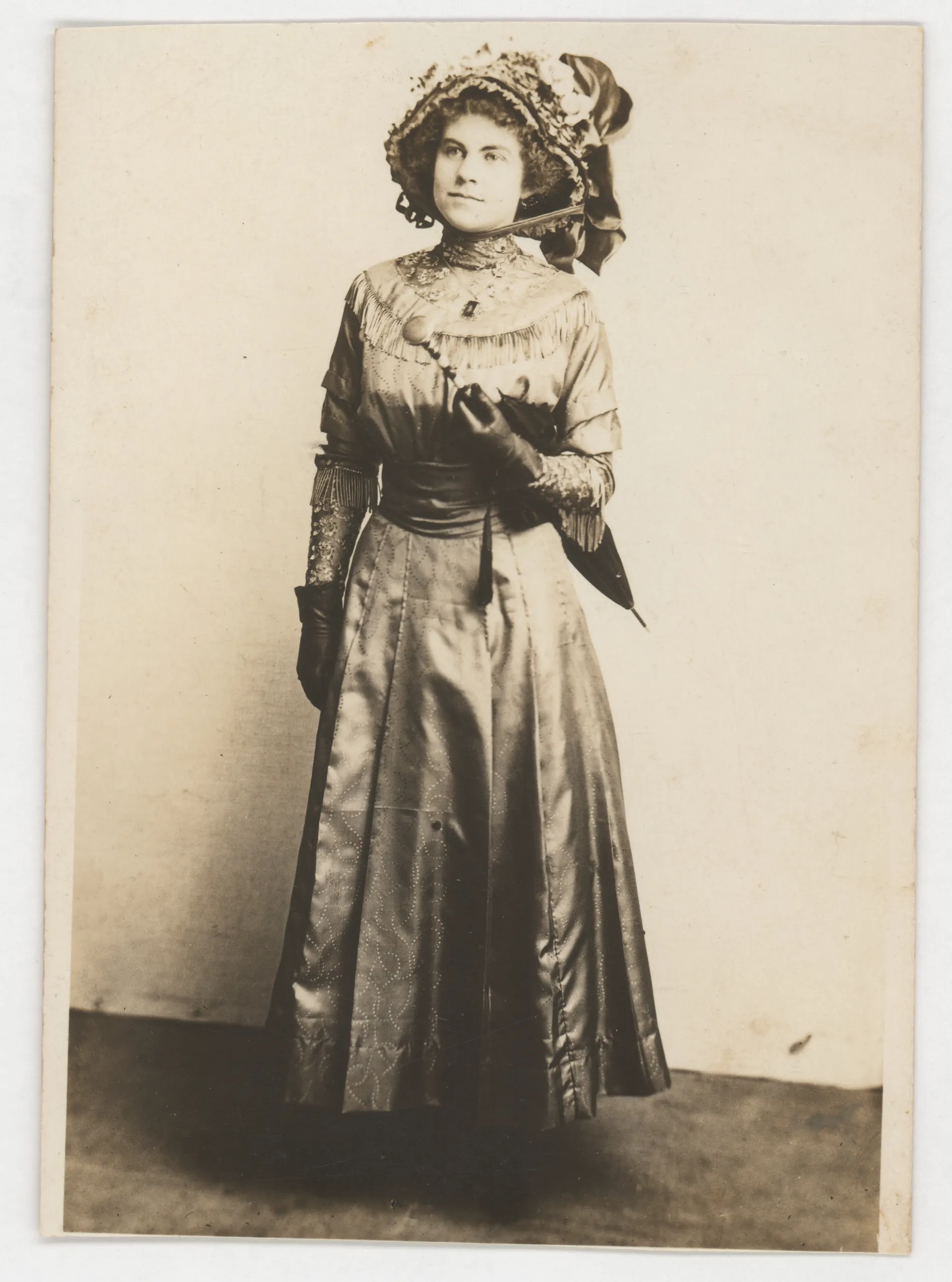 This photograph depicts Loveta Swann in her baccalaureate dress and hat in 1910. The family had moved to New Mexico by this date, so it was likely taken in New Mexico.