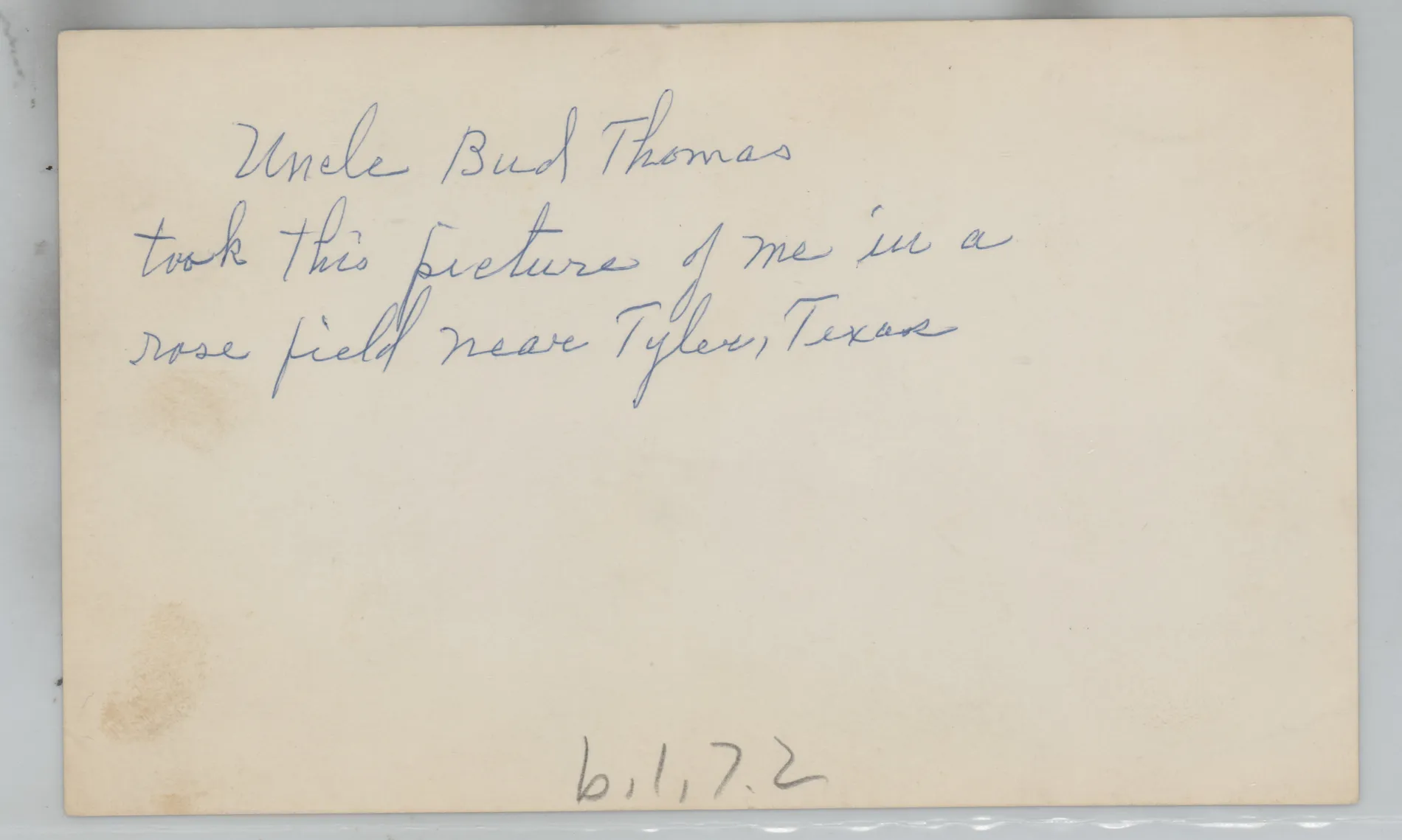 Verso: [Loveta Swann in a field near Tyler, Texas]
