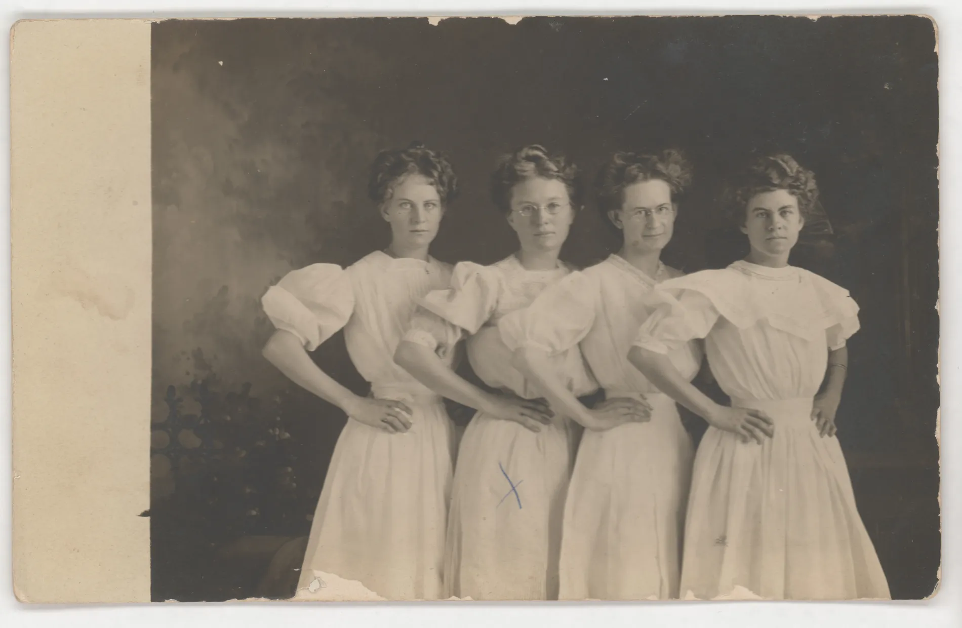 This photograph depicts sisters Minnie, Eva, and Loveta Swann and a cousin Annie Miller. A date on the verso suggests this photograph was taken about 1910. Nothing disputes that.