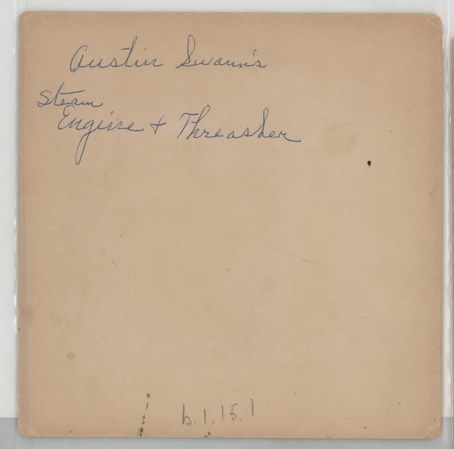 Verso: Austin Swann's steam engine and thresher