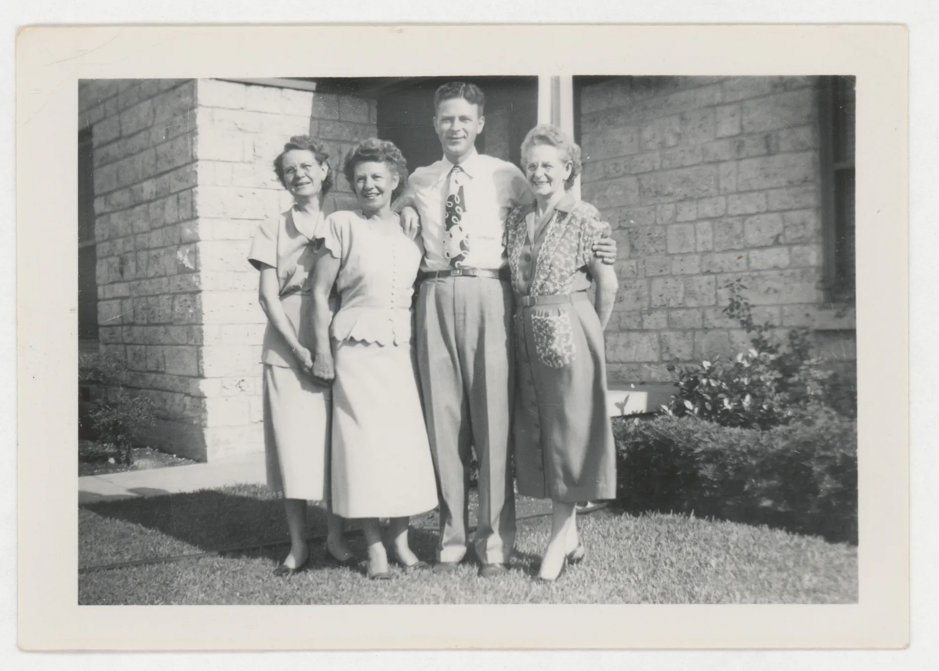 This is a photograph of Minnie McKinstry Swann, Loveta McKinstry Swann, Glenn Zirkle, Eva West, and Mrs. Major. Another photograph from this trip suggests it was taken in Dallas, Texas.