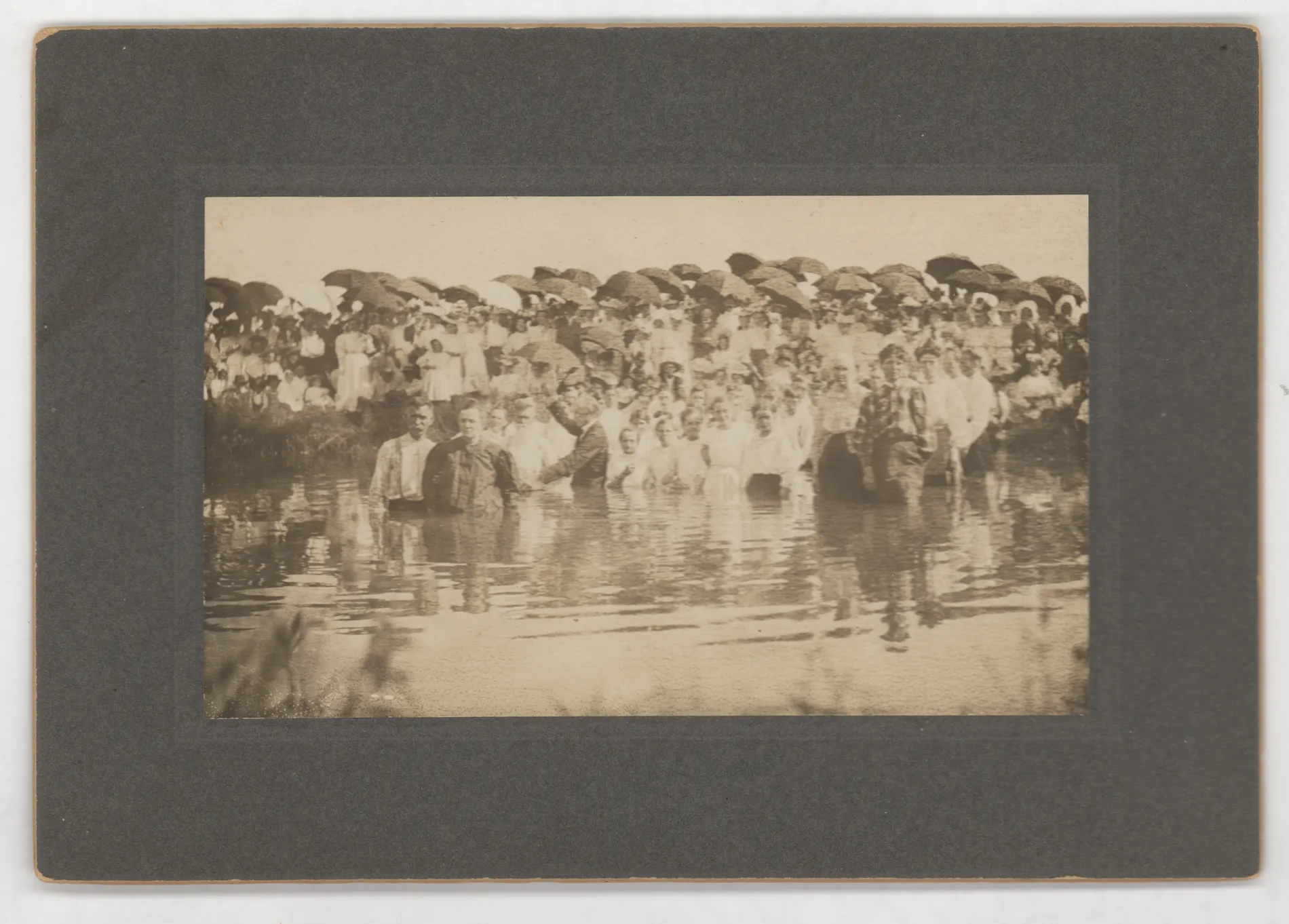 This photograph depicts a baptism led by Dr. Jim Truett of Dallas.